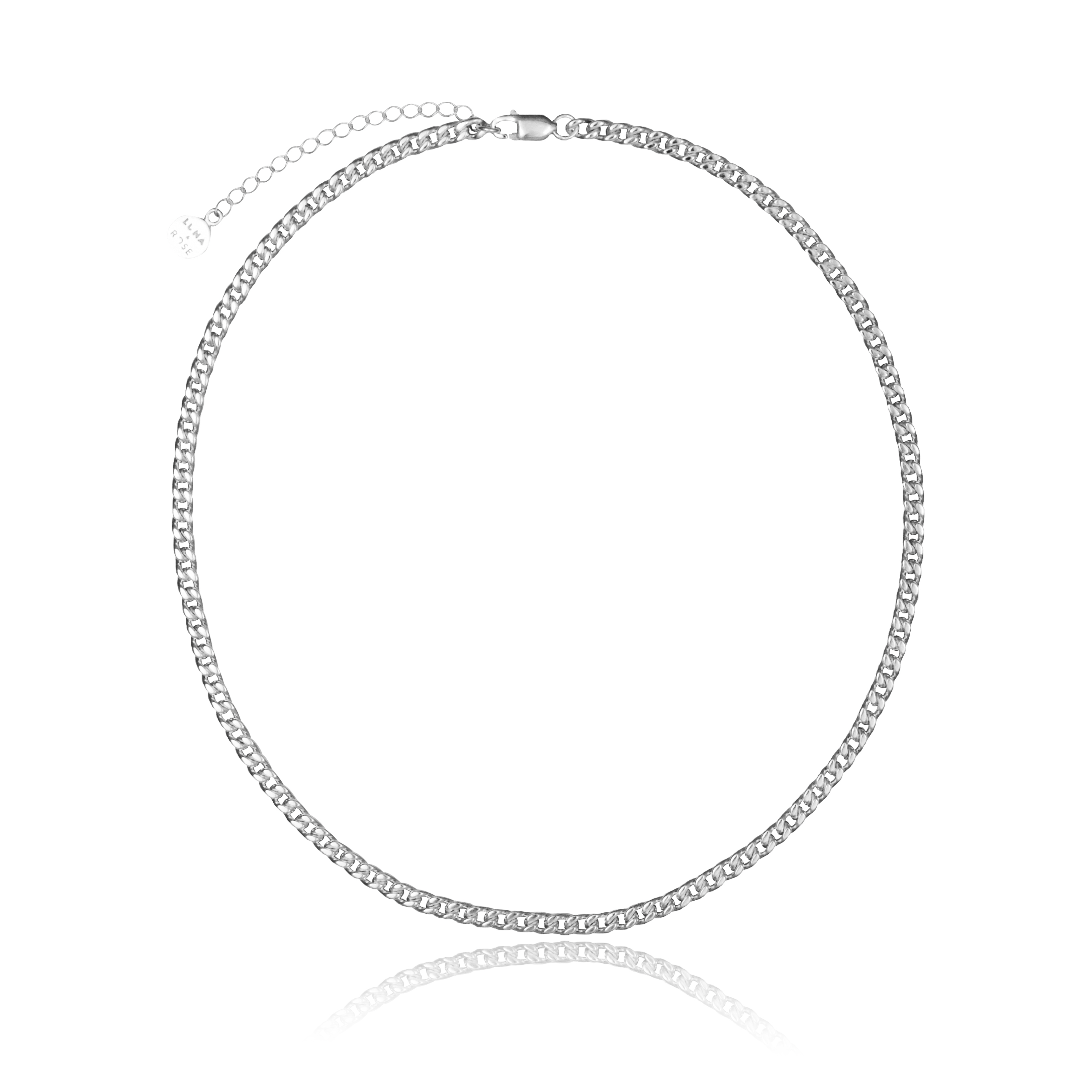 A single silver chain necklace with flat, interlocking links and an extension chain ending in a round charm and white background