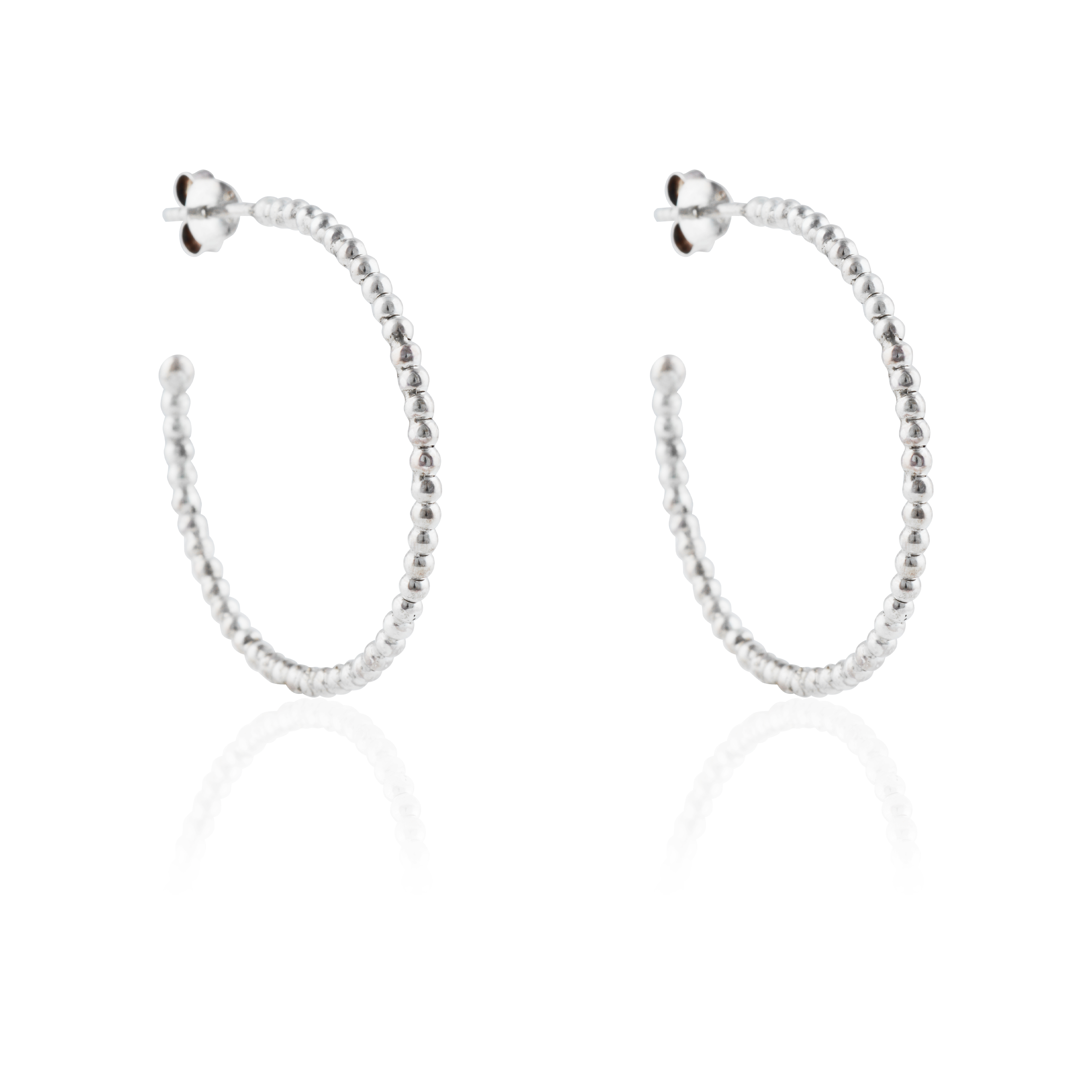 Thin silver beaded earrings angled slightly, shown against a white background.