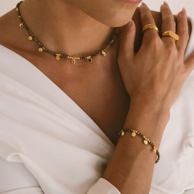 Delicate droplet necklace adorned with small bead
