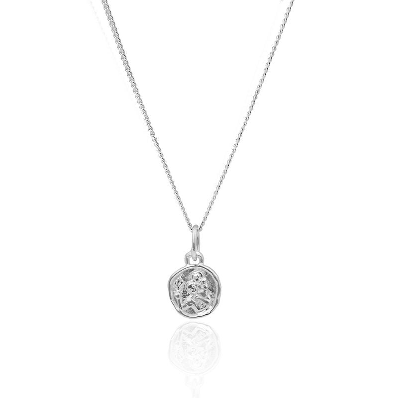 Delicate mini St. Christopher necklace on a plain white background.