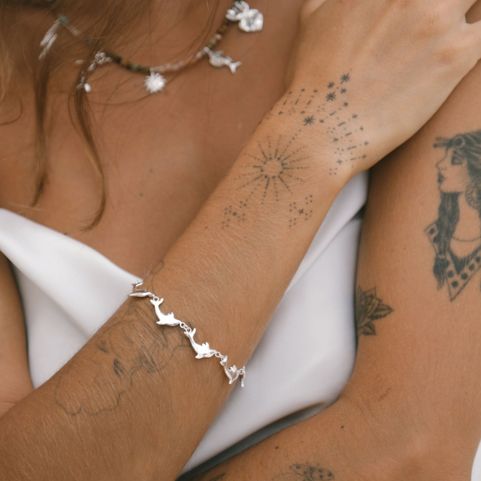 Handmade Luna & Rose x Tahnee Kelland ‘Vibes Don’t Lie’ silver bracelet, dolphin design symbolising flow, crafted sustainably in Bali close up.