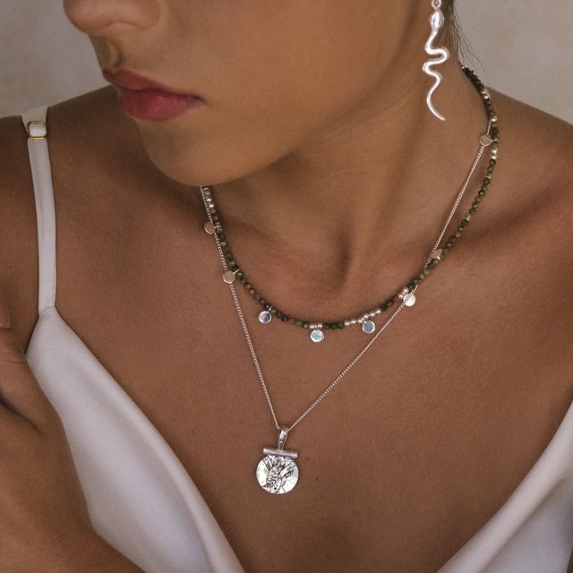 Fashionable layered silver necklace featuring on her