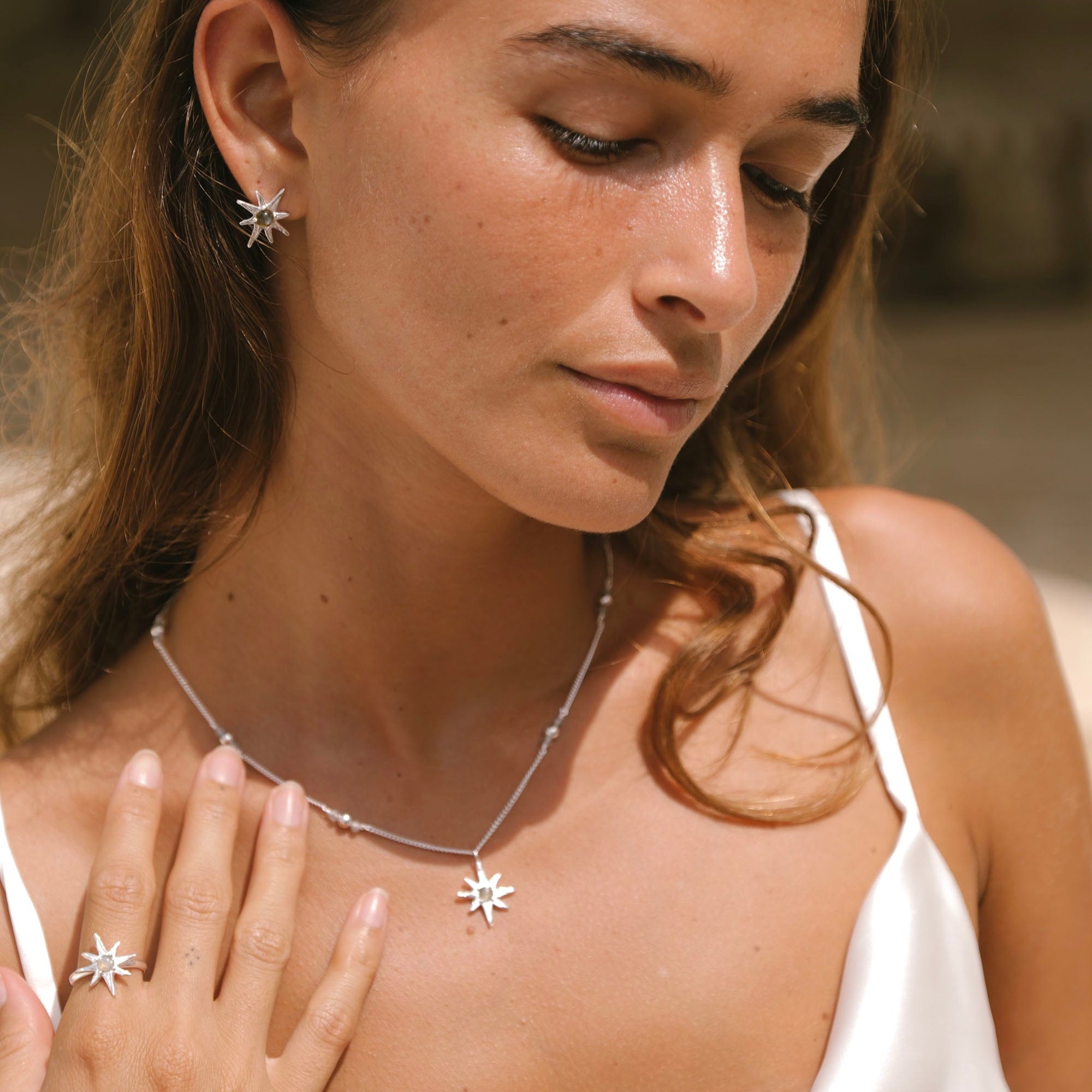 Tahnee Kelland x Luna & Rose Star Necklace in Silverworn by a Woman wearing it in silver jewelry