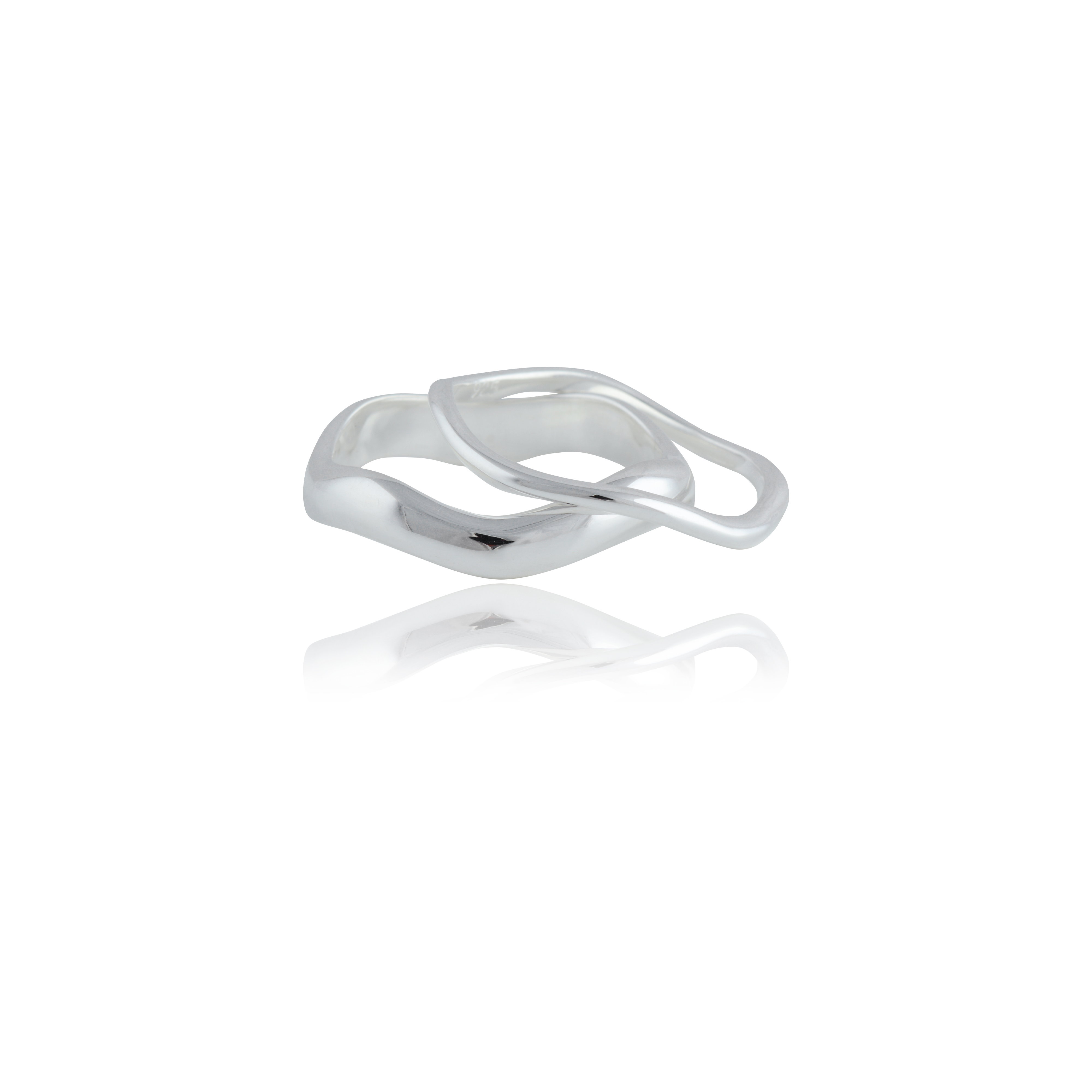 A silver ring with a fluid, intertwined design on a white background.