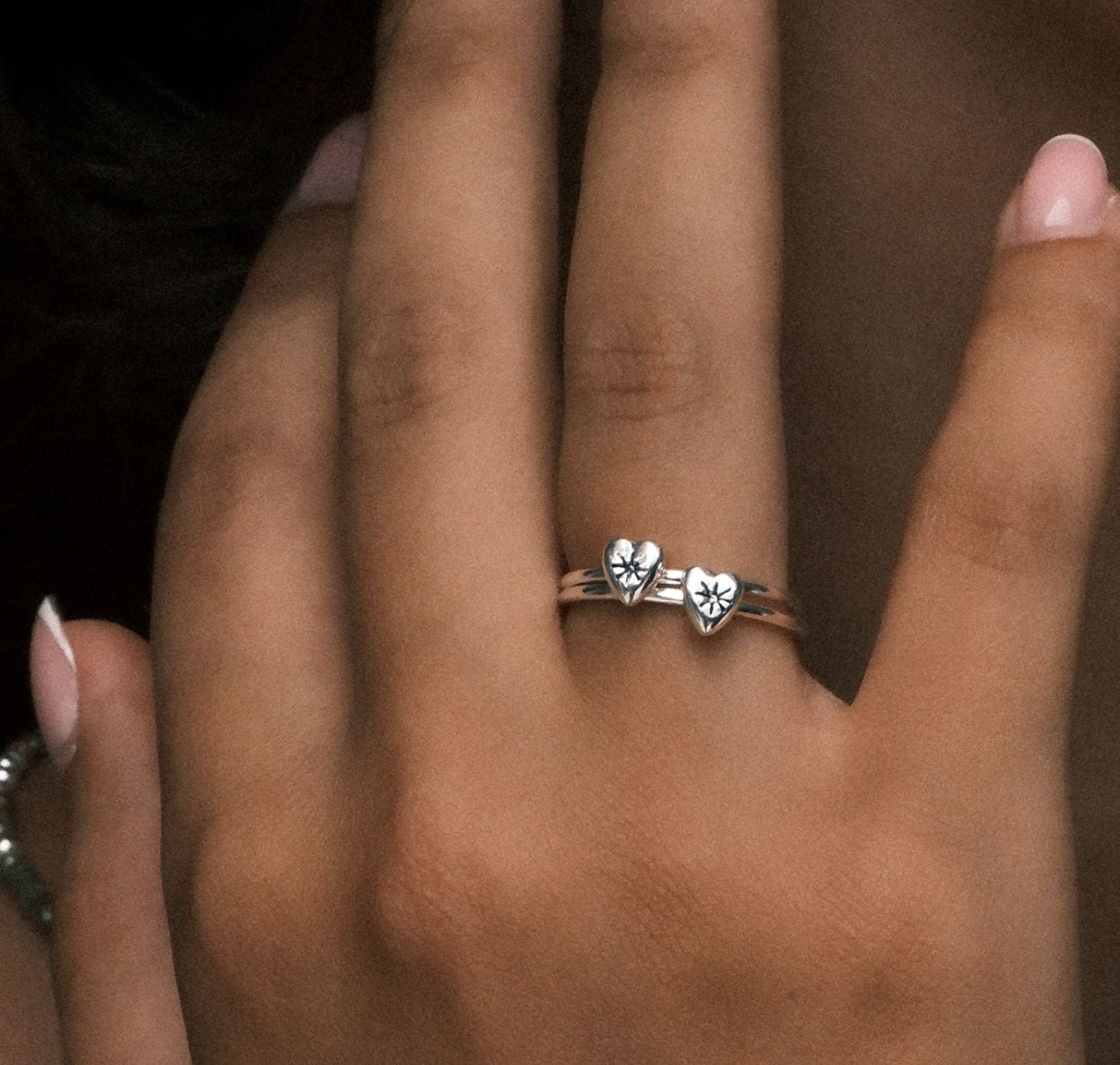Twi Silver mnini heart rings on finger