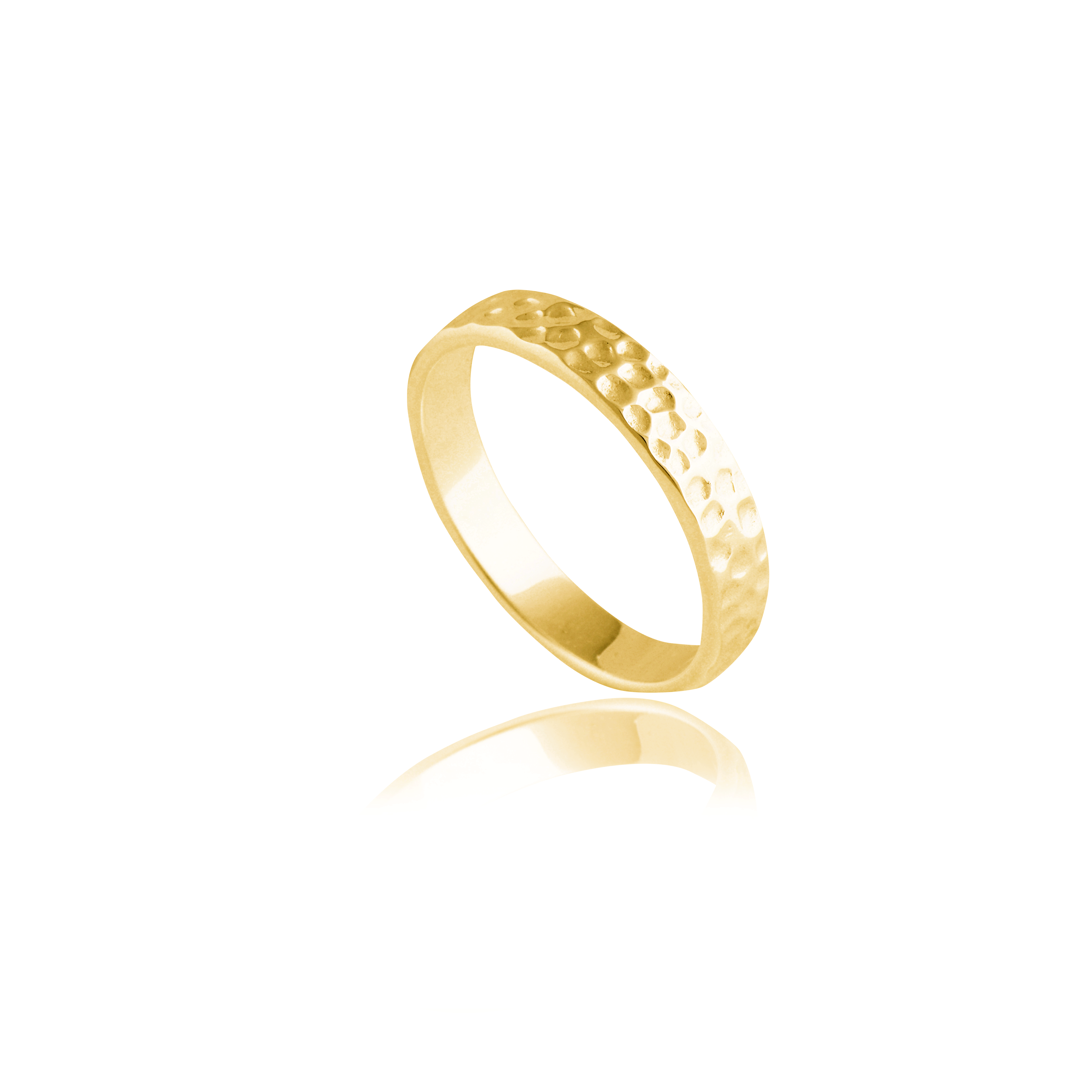 A gold hammered ring isolated on a white background with a reflection.