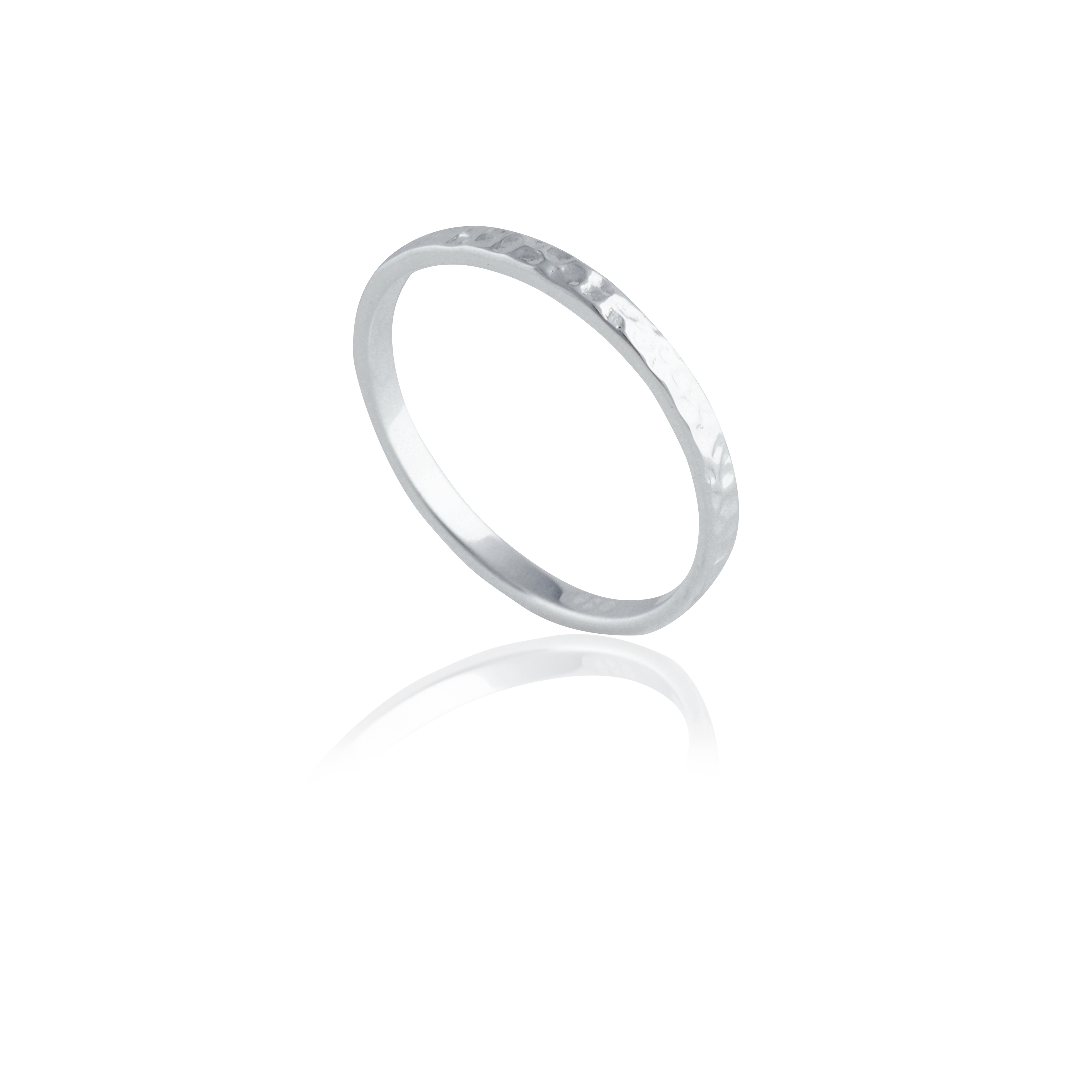 A silver hammered ring isolated on a white background with a reflection.
