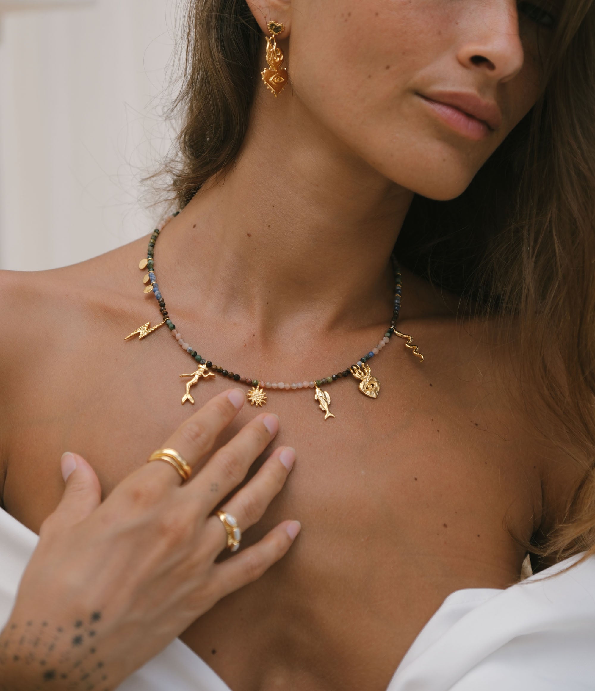 Luna & Rose x Tahnee Kelland ‘Riding Tides’ gold charm necklace with natural gemstones, handmade in Bali from recycled sterling silver and Gold vermeil model front view