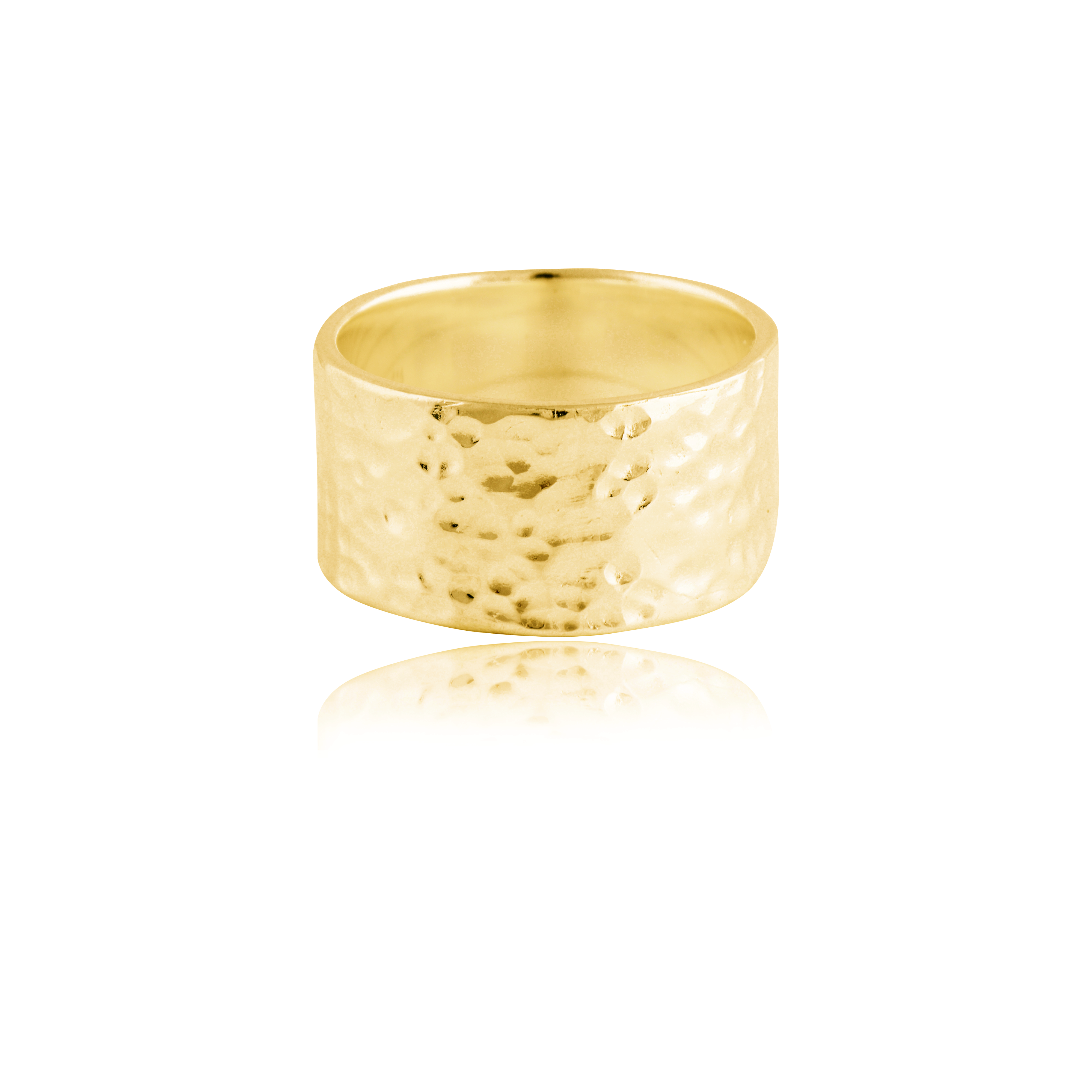A wide gold hammered ring isolated on a white background with a reflection.