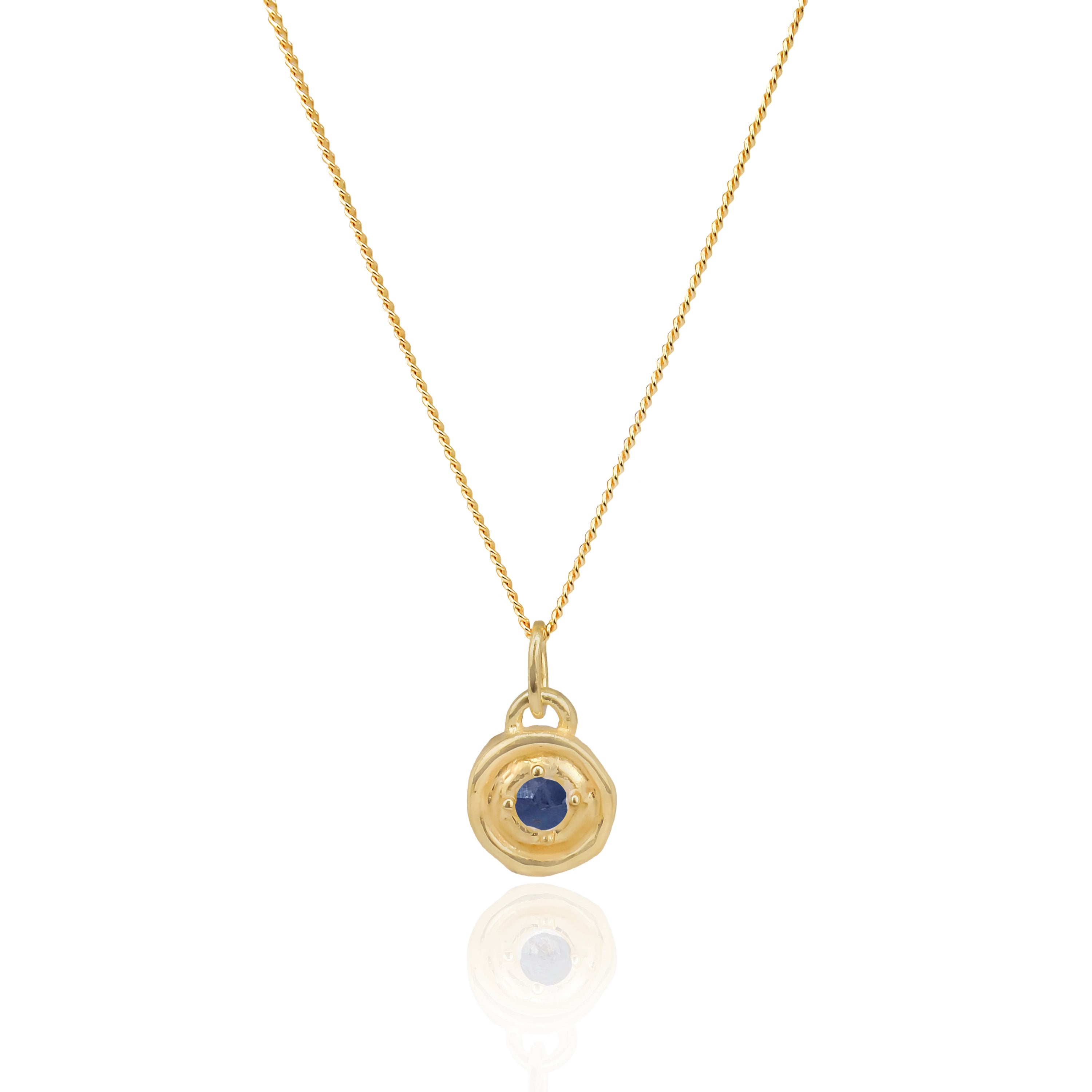 Gold necklace with a pendant featuring a blue gemstone on a white background