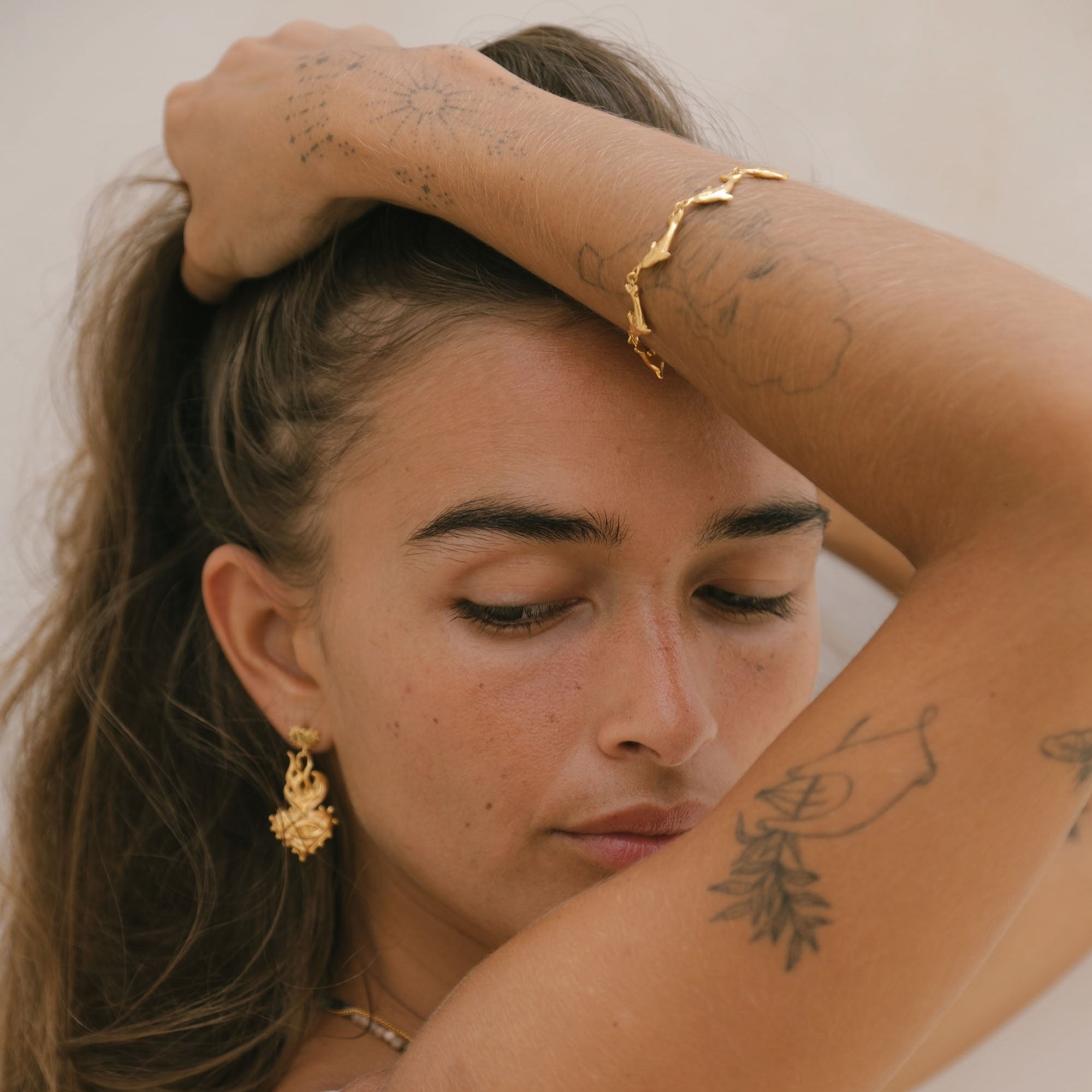 Luna & Rose x Tahnee Kelland ‘Vibes Don’t Lie’ gold bracelet with dolphin motif, handmade in Bali from recycled sterling silver Side Angle