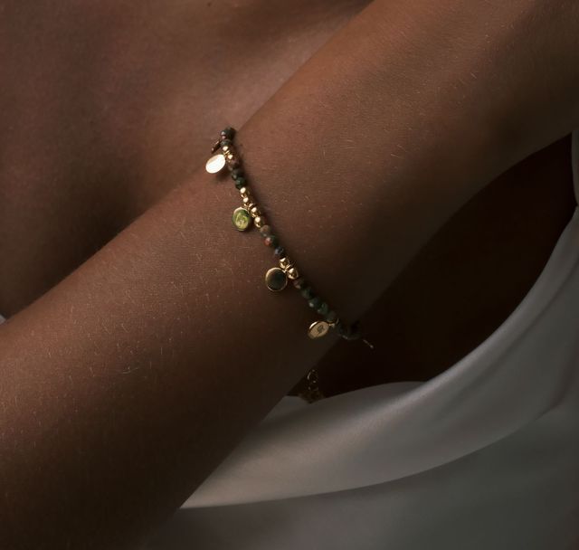 a woman wearing Sienna Sol Bracelet Gold by Luna and Rose Bali