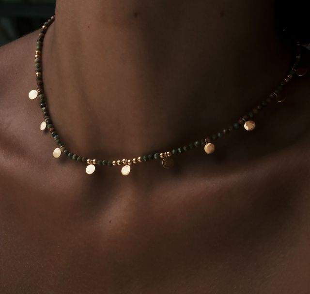 a woman wearing Sienna Sol Necklace Gold by Luna and Rose Bali