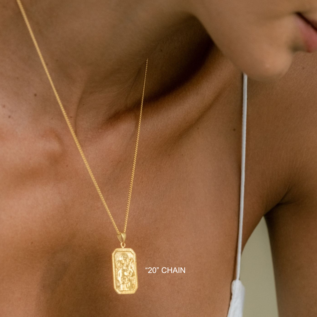 Gold necklace with a pendant on a person's neck, with '20" Chain' text.