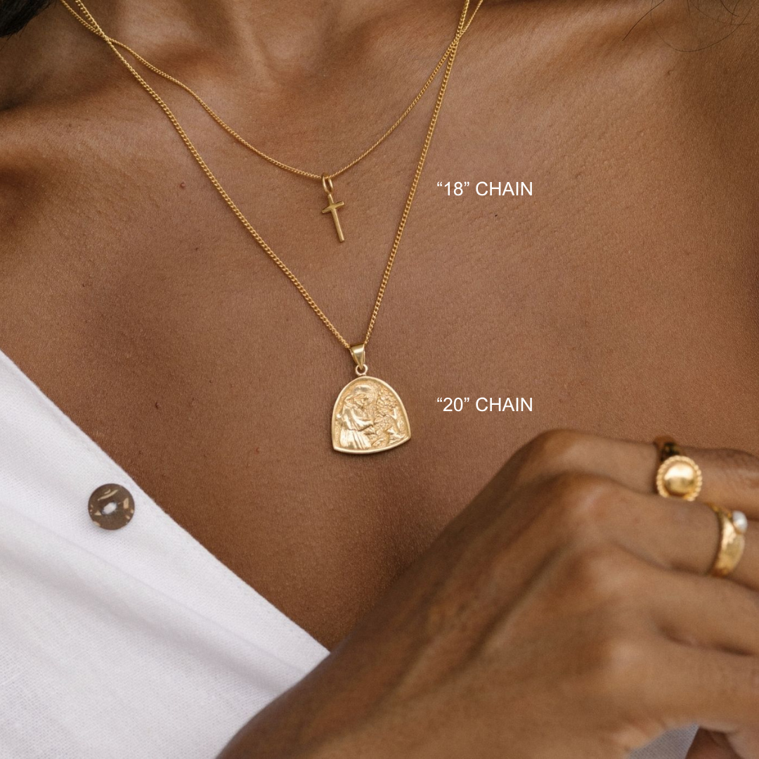 Gold necklaces with pendants on a person's neck, labeled '18' chain' and '20' chain'.