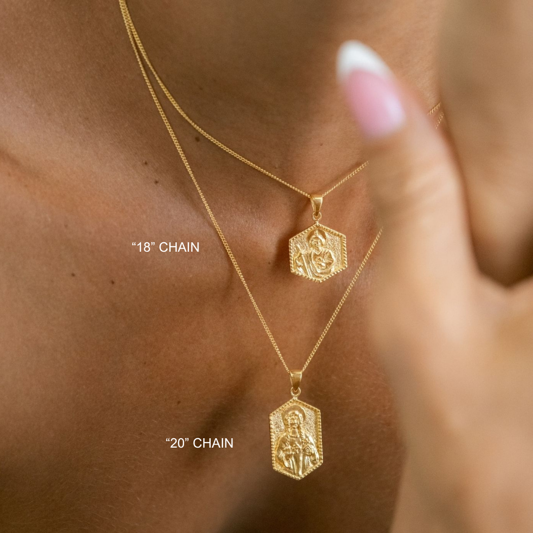 Gold necklaces with pendants on a person's neck, labeled '18' chain' and '20' chain'.