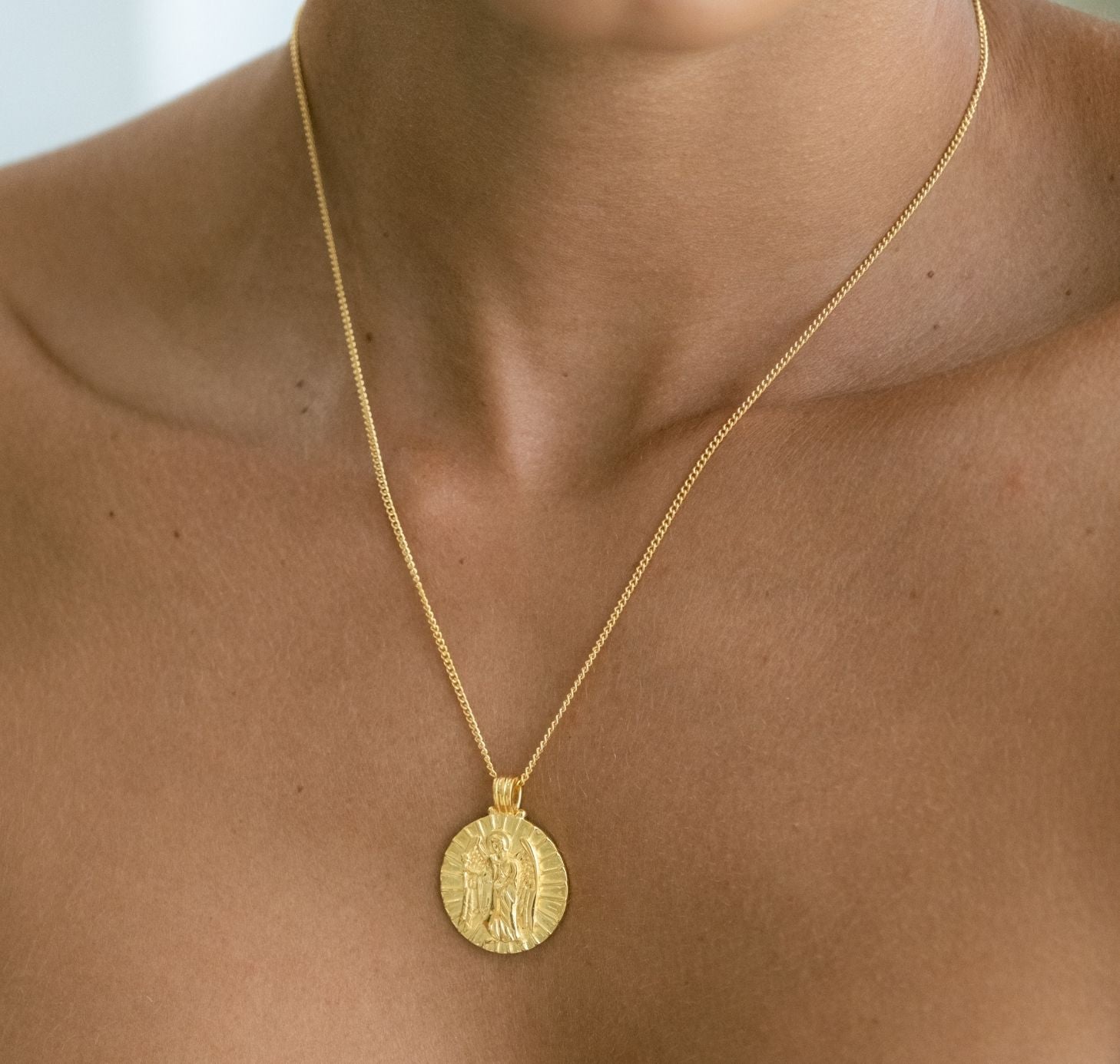 St Gabriel - Archangel Saint of Communication gold on a woman