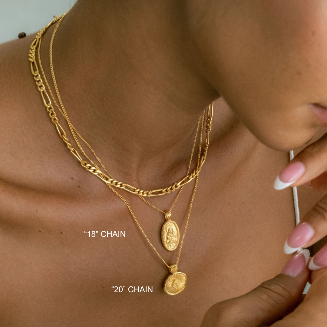 Close-up of a person wearing gold necklaces with chain lengths labeled.