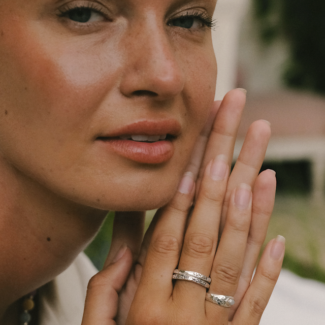 Sunlit look with shimmering silver jewelry on a woman