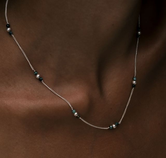 a woman wearing The Quinn Necklace Silver by Luna and Rose Bali