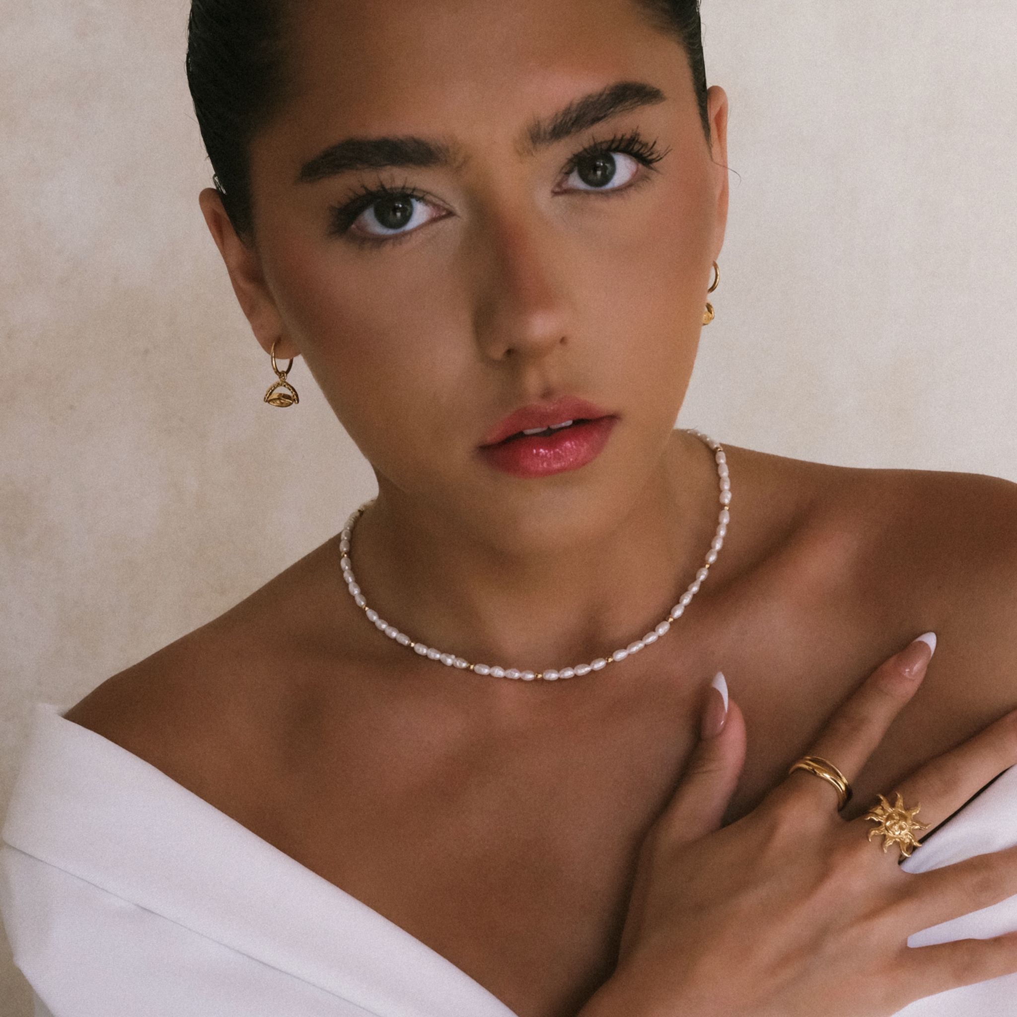 a woman with multiple jewelry on her