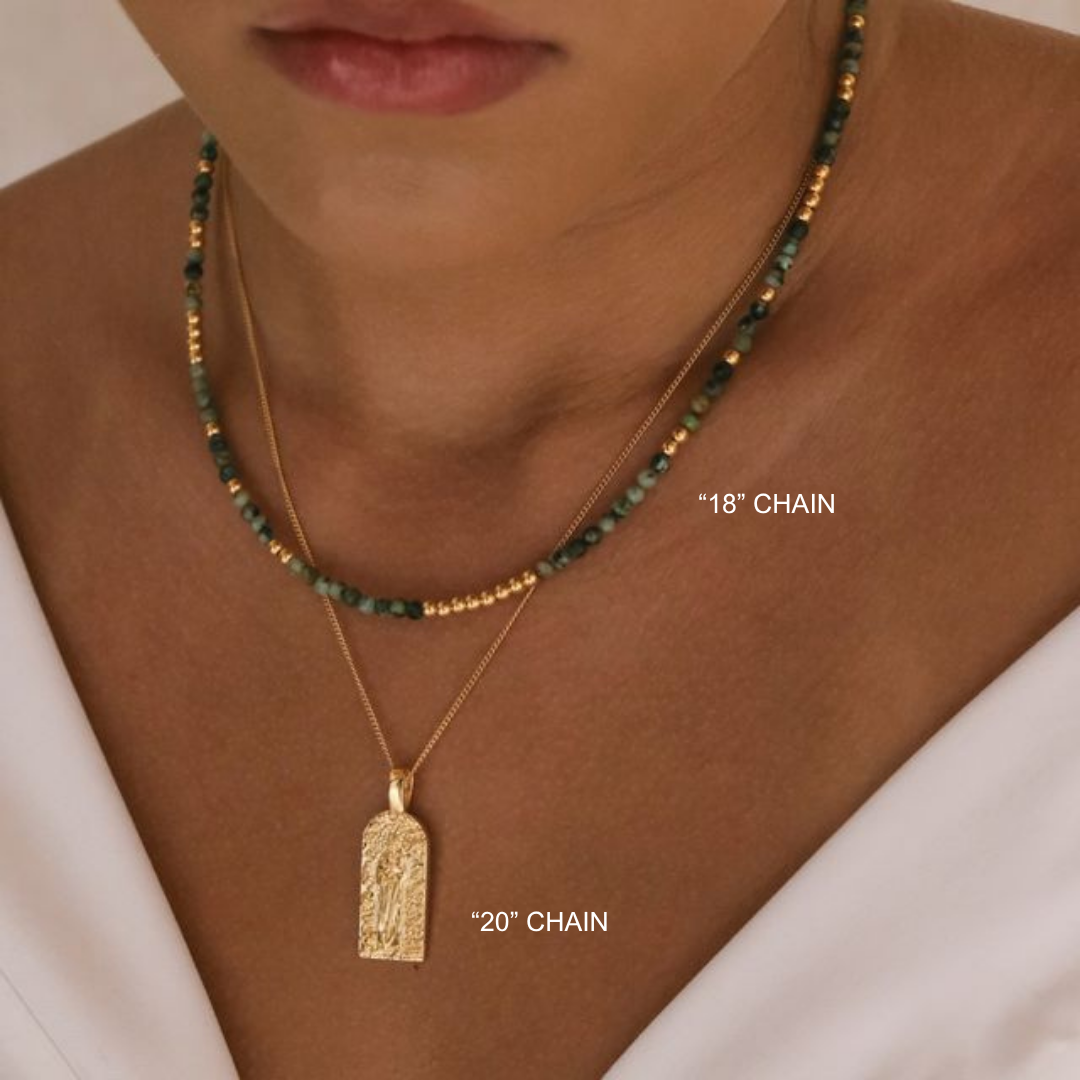 Necklace with two chains labeled '18' Chain' and '20' Chain' on a neutral background.