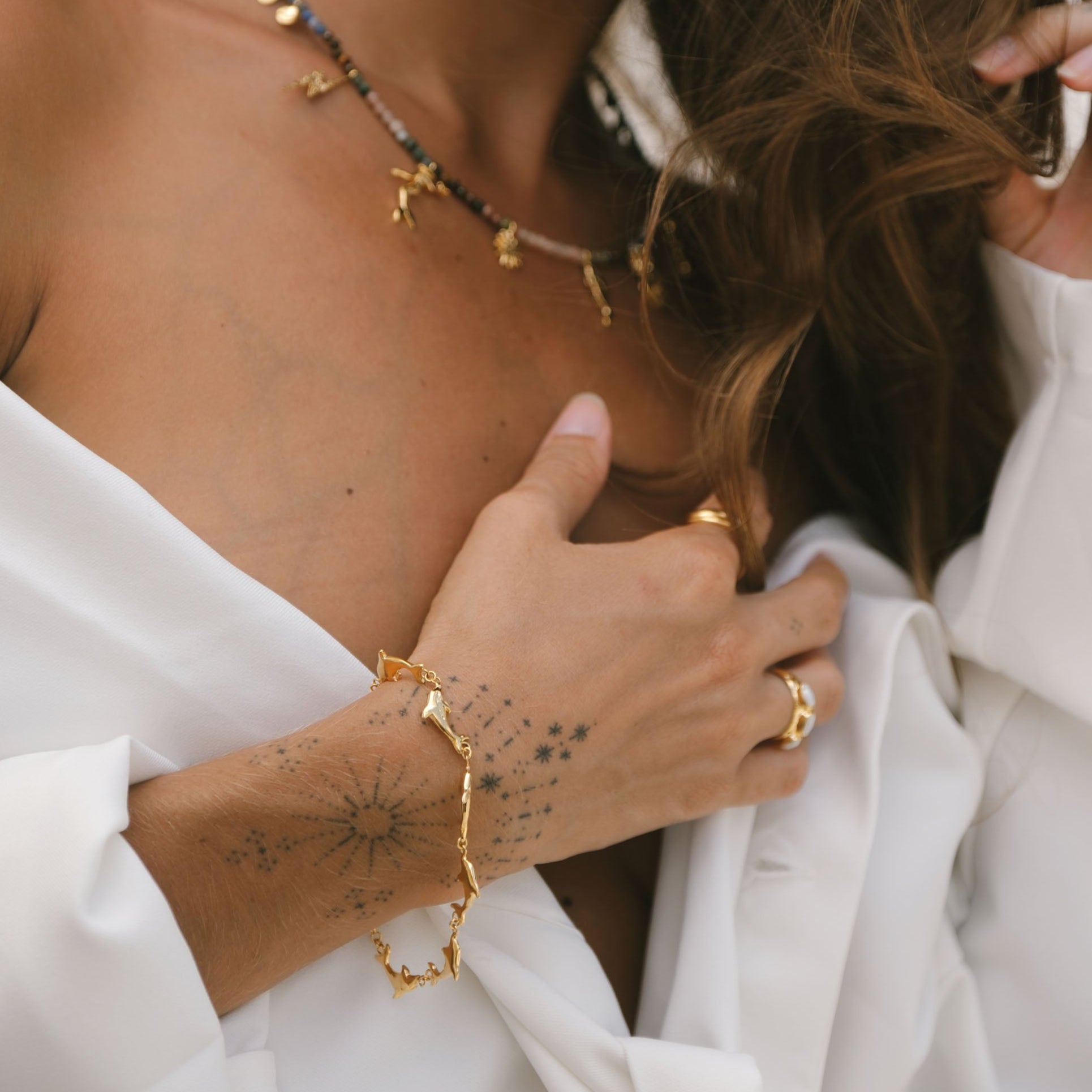 Luna & Rose x Tahnee Kelland ‘Vibes Don’t Lie’ gold bracelet with dolphin motif, handmade in Bali from recycled sterling silver.