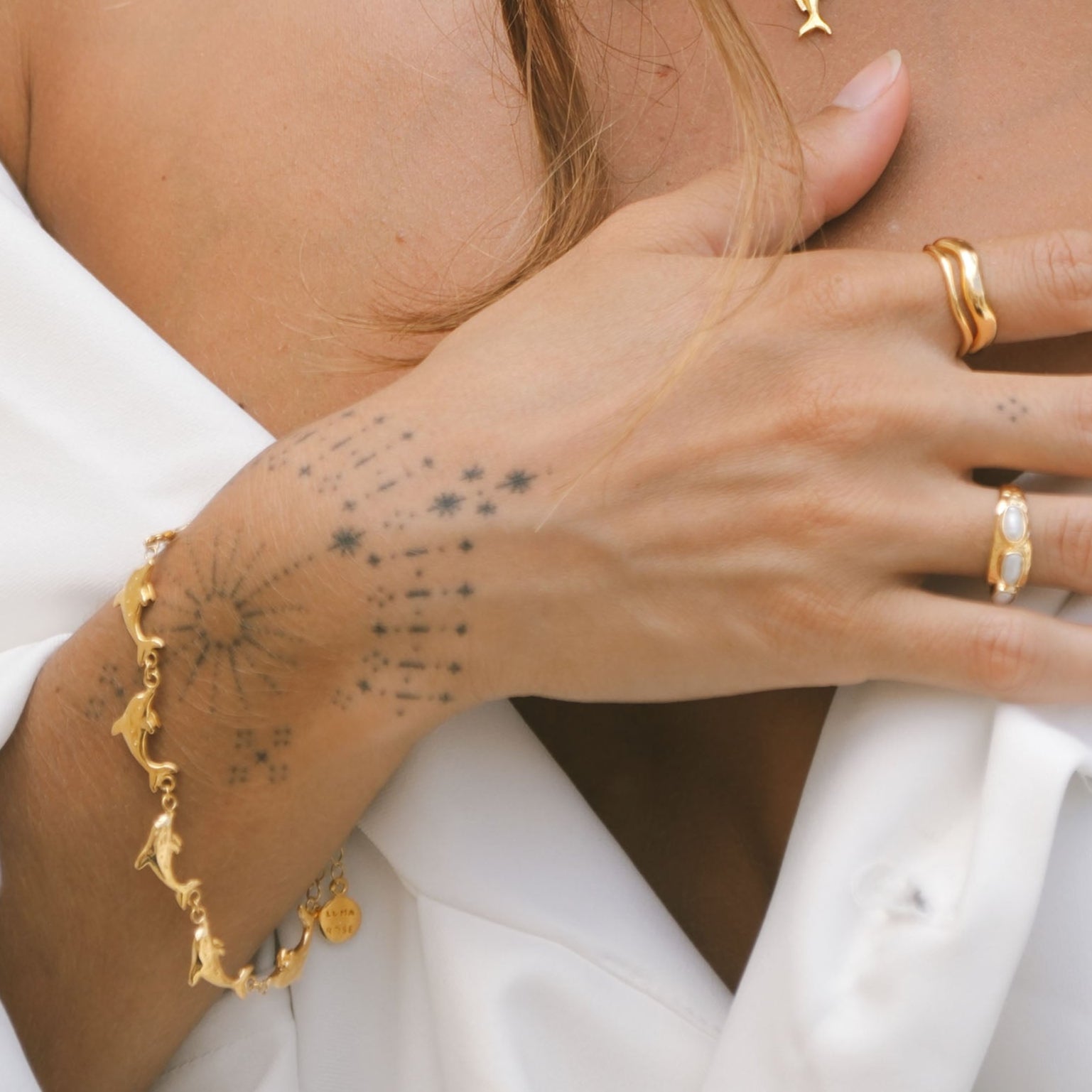 Luna & Rose x Tahnee Kelland ‘Vibes Don’t Lie’ gold bracelet with dolphin motif, handmade in Bali from recycled sterling silver.