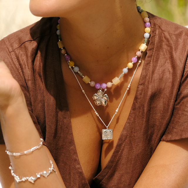 Sophisticated outfit featuring a cocoa dress and silver jewelry by luna rose bali