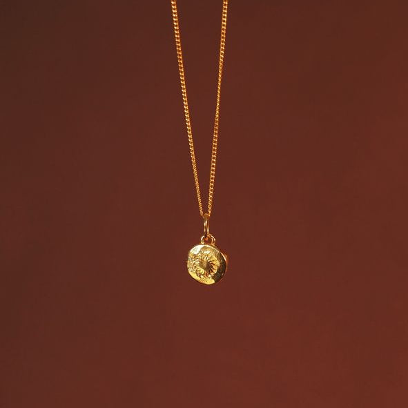 back side of mini St Christopher charm gold