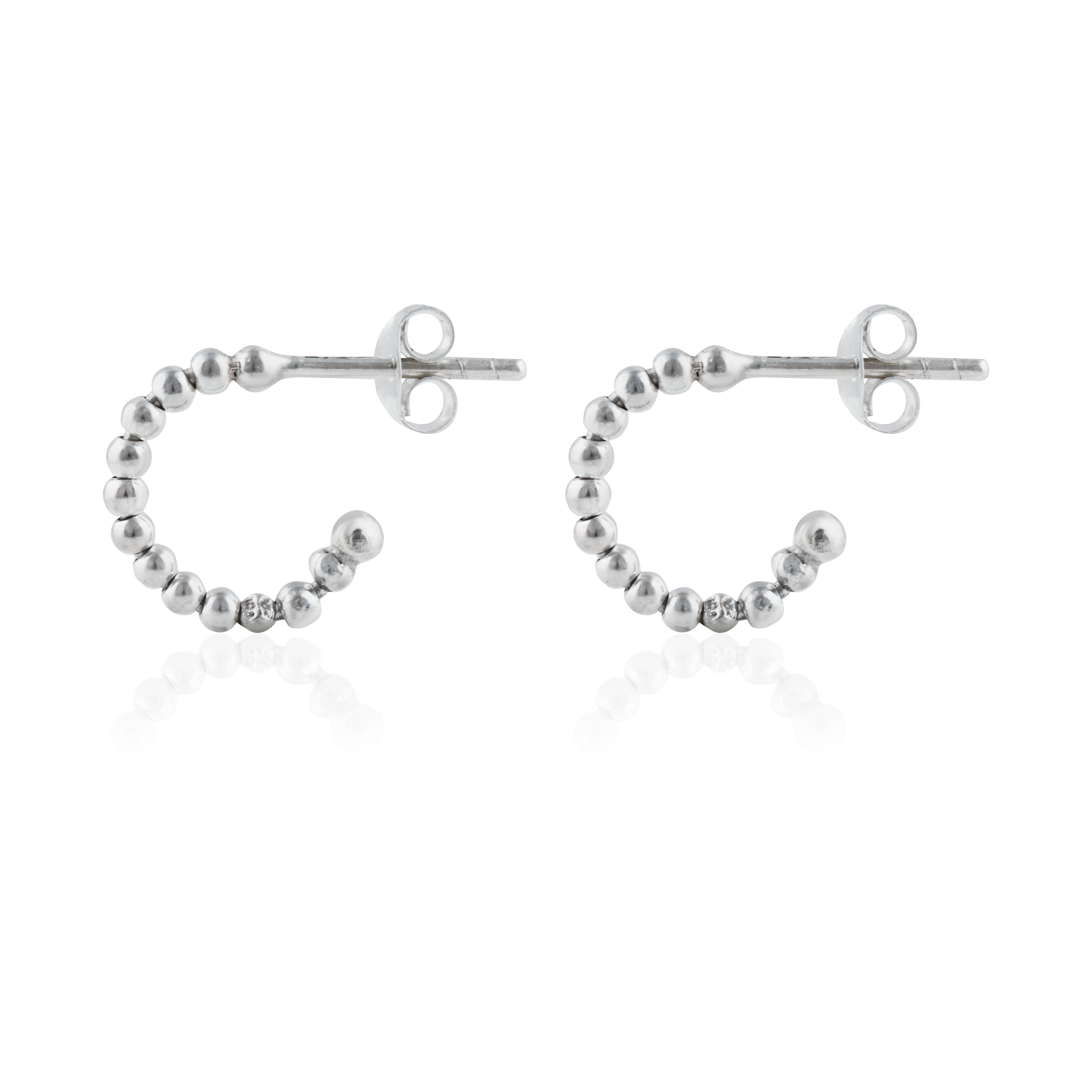 Thin silver beaded earrings angles from side, shown against a white background.