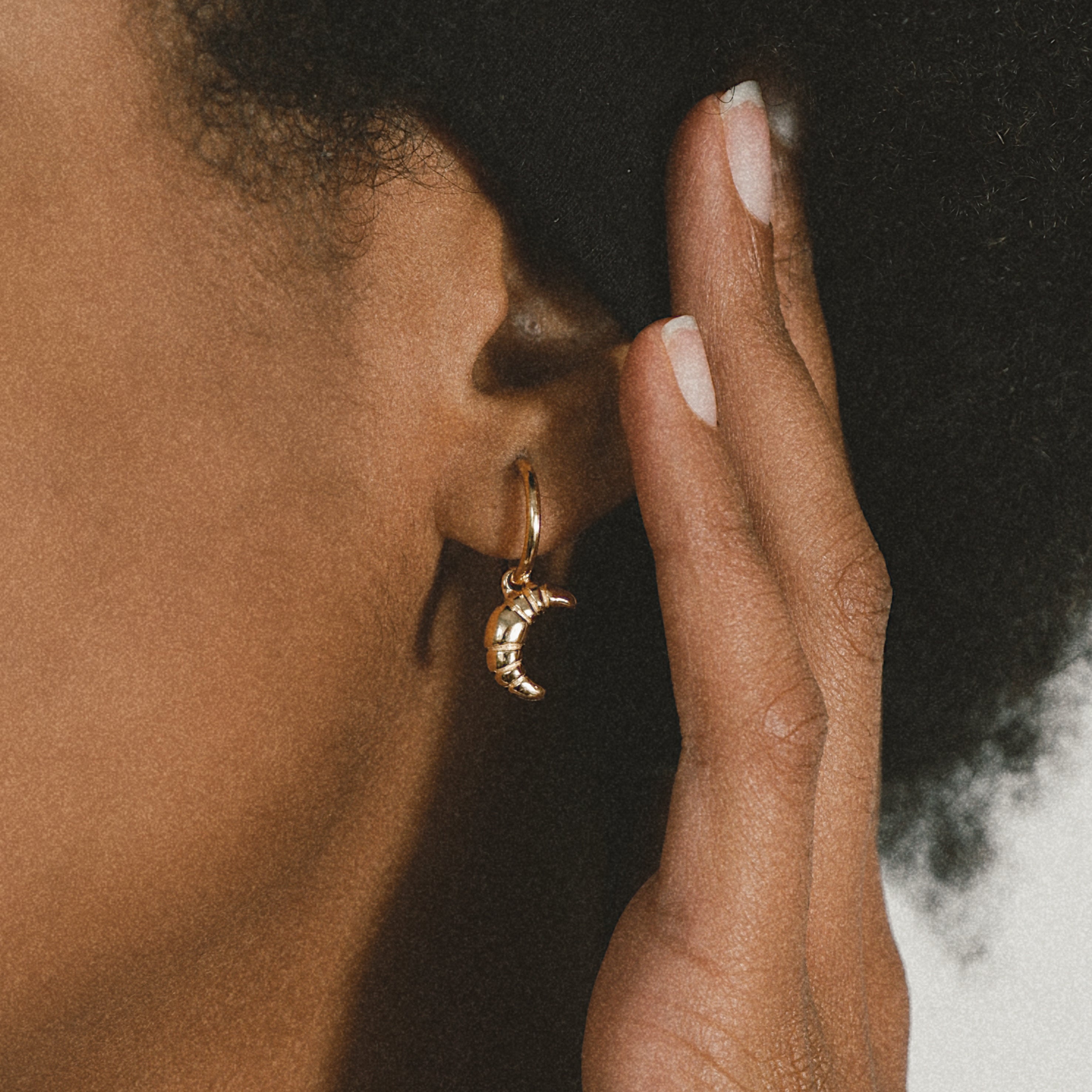 Gold Croissant Earrings from the ACME x Luna & Rose collection, unique croissant-shaped earrings for a playful yet elegant everyday look.