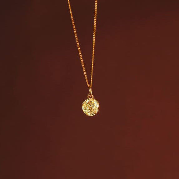 front side of mini St Christopher charm gold