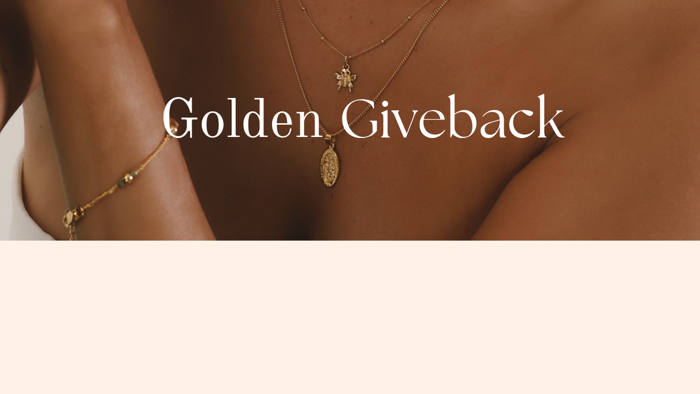 Gold jewelry on a person's wrist with 'Golden Giveback' text.