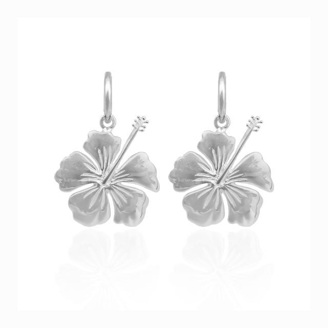 Close-up of hibiscus stylish earrings on a plain white background