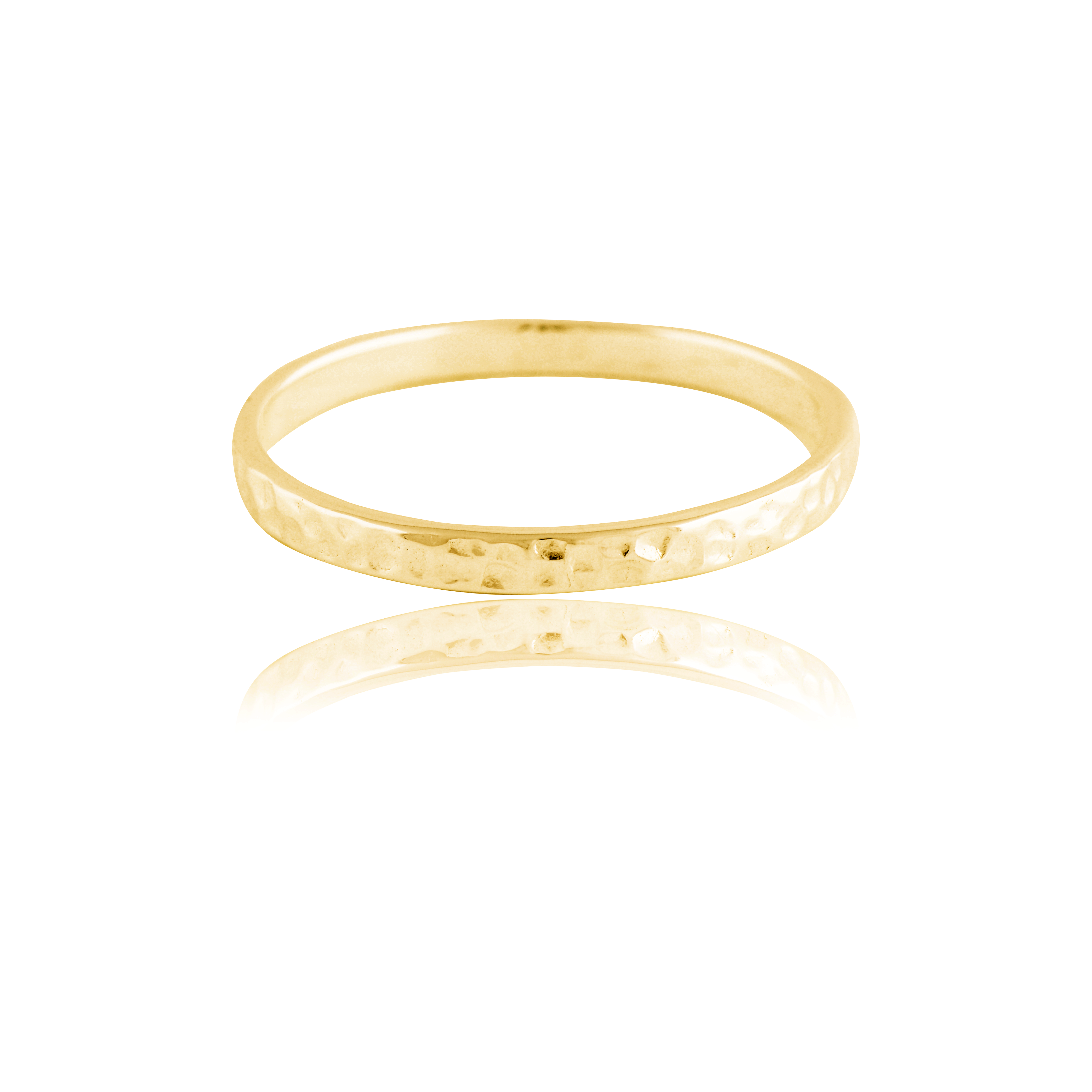 A single narrow, gold hammered ring isolated on a white background with a reflection.