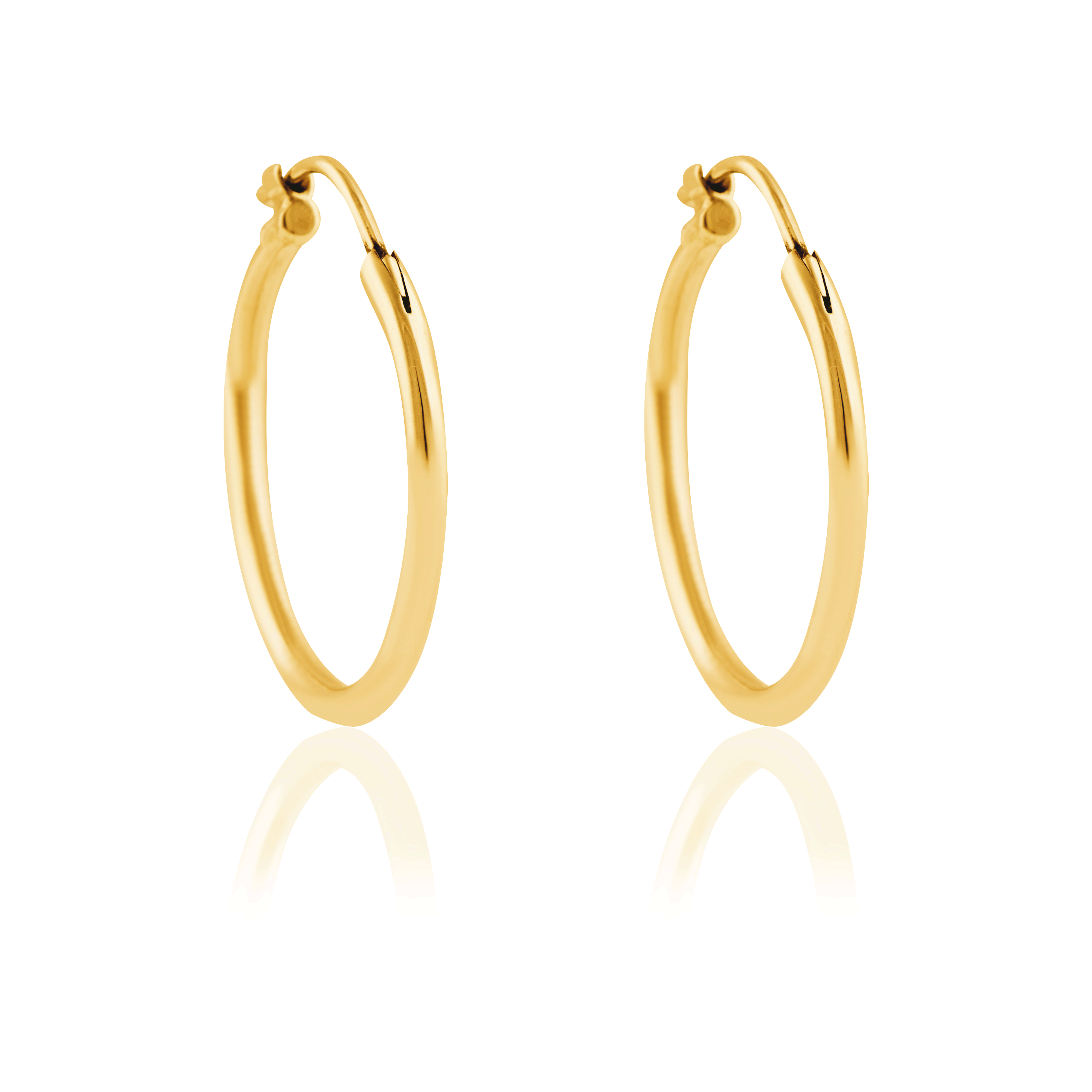 a pair of signature hoops earrings gold 25mm midi on white white background