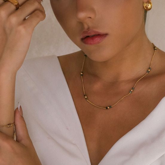 Glamorous woman accessorized with gold jewelry