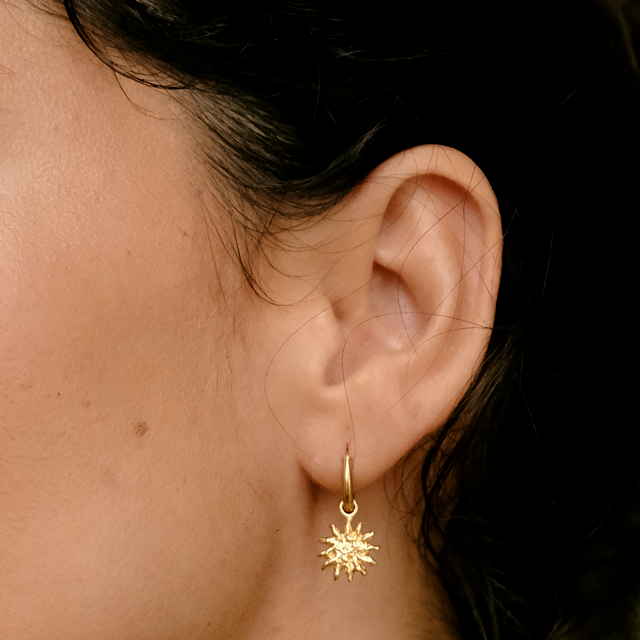 warm love earrings gold on a woman by luna rose