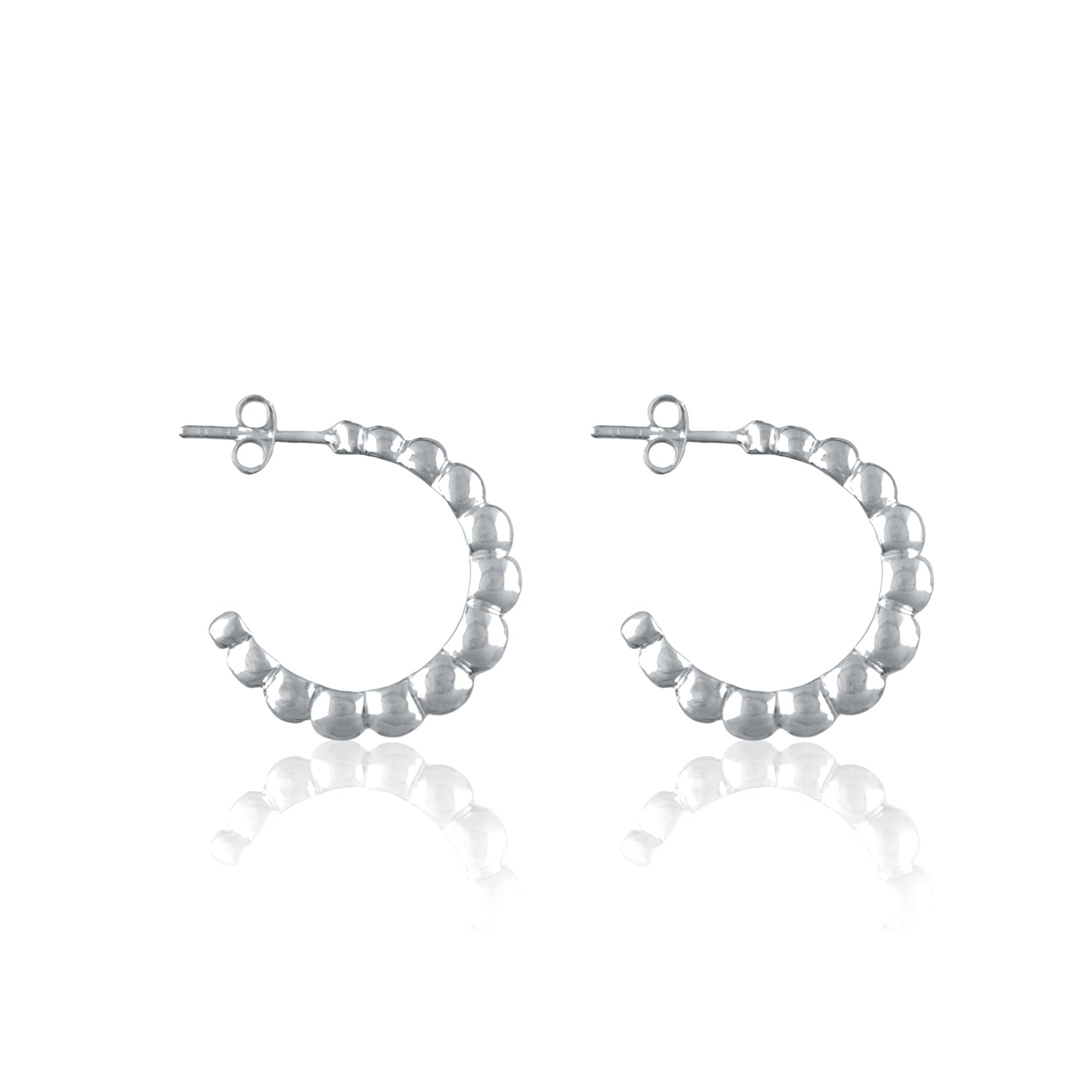 Silver earrings on a white background