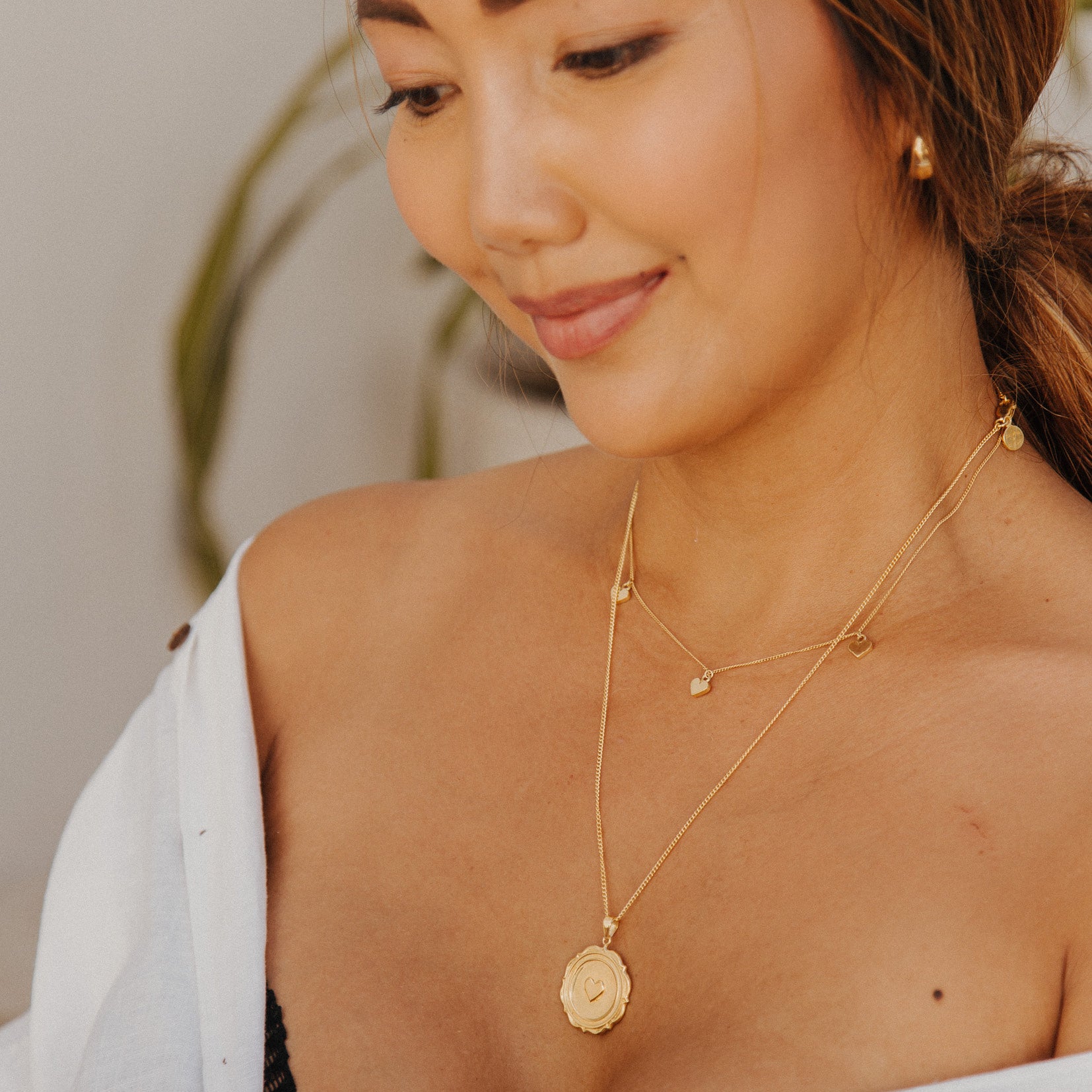 Triple heart necklace in Gold