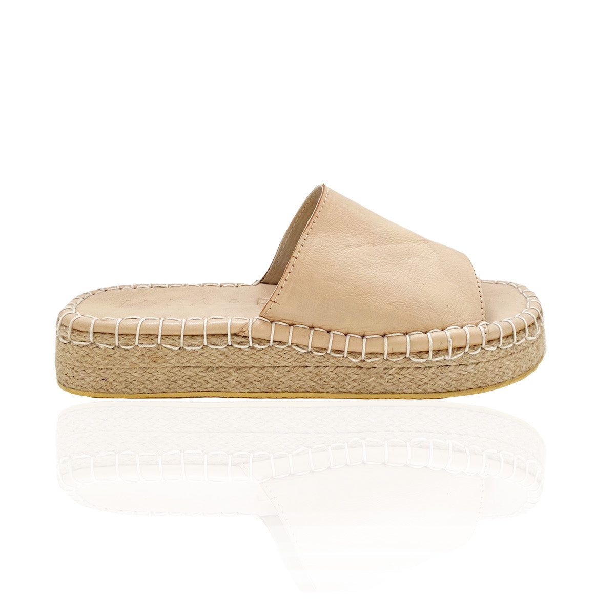 A side profile of a tan platform sandal with a woven sole on a white background.