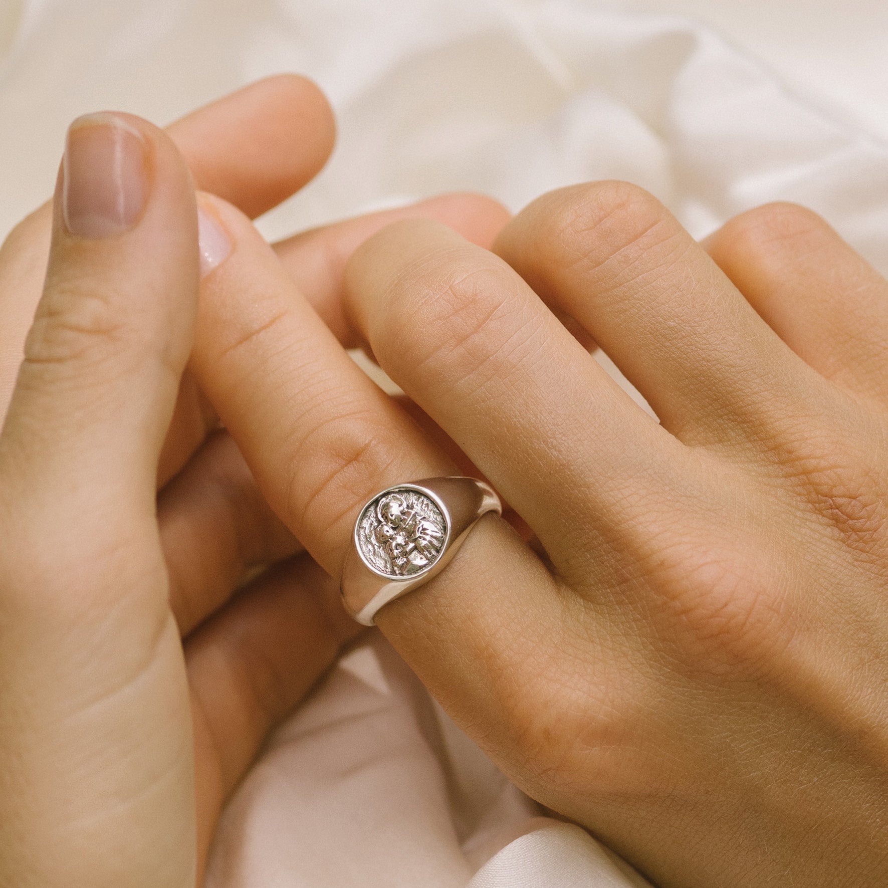 a woman worn signet ring silver on her finger