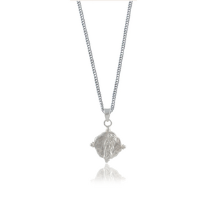 A silver necklace with a pendant featuring a religious figure designs design.