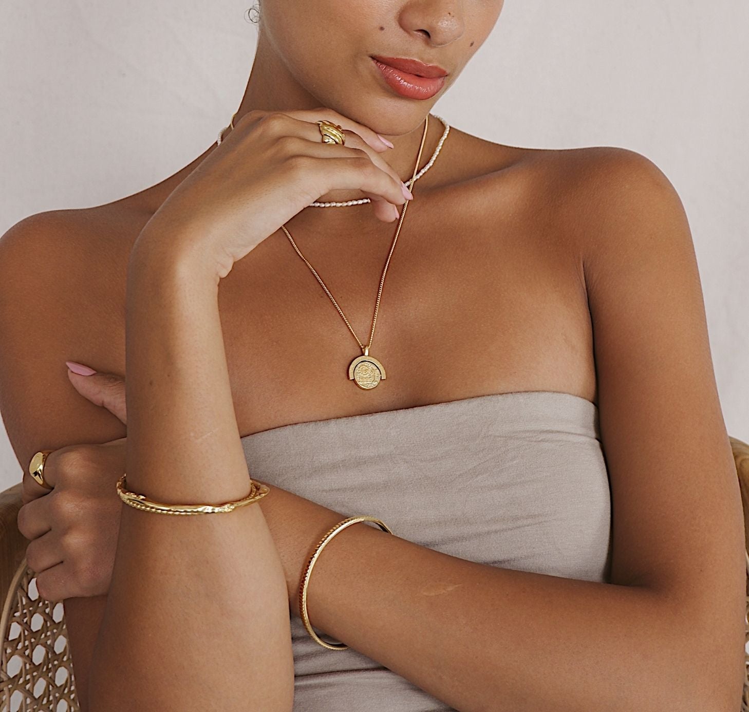  close-up photo of a woman wearing  jewelry necklace 