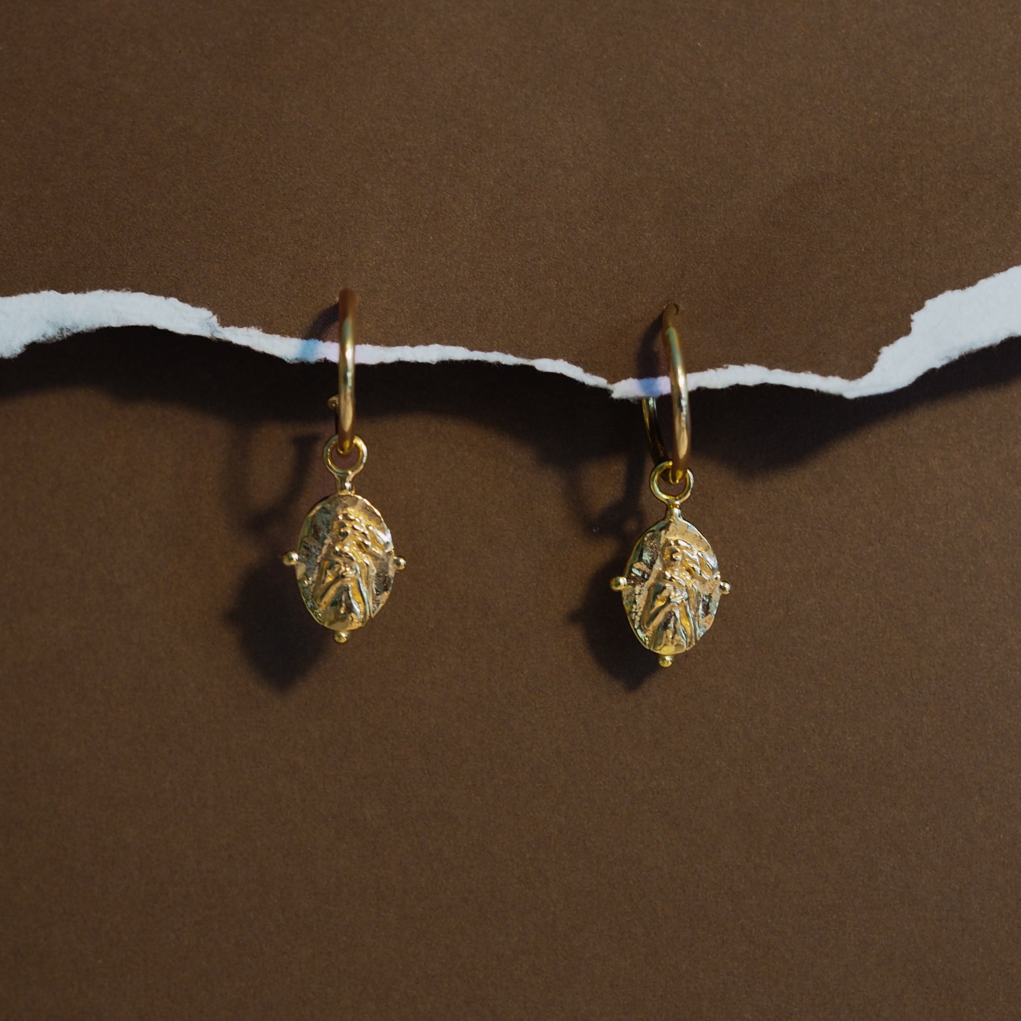 Gold hoops with Aphrodite charm