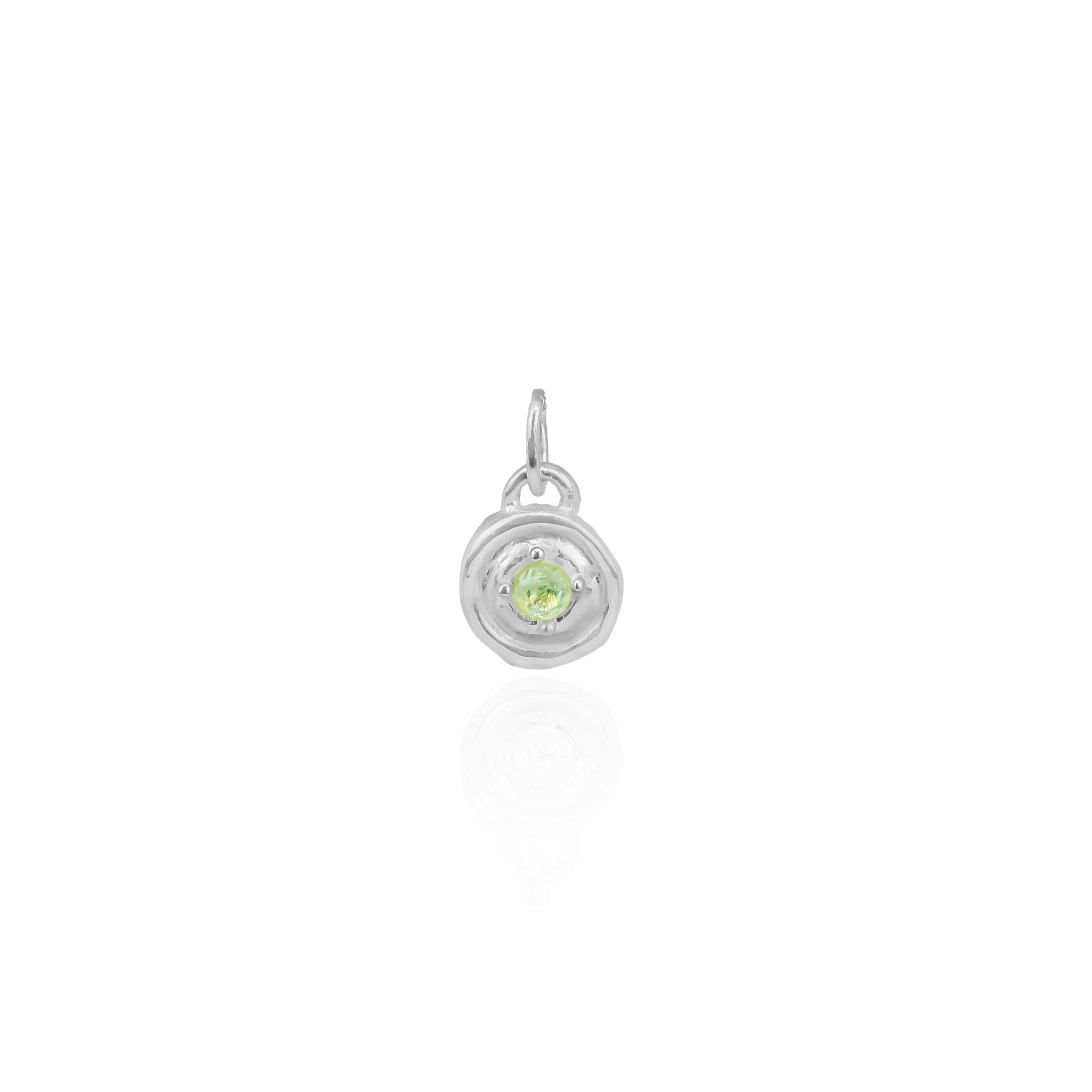 Silver pendant with a green gemstone on a white background