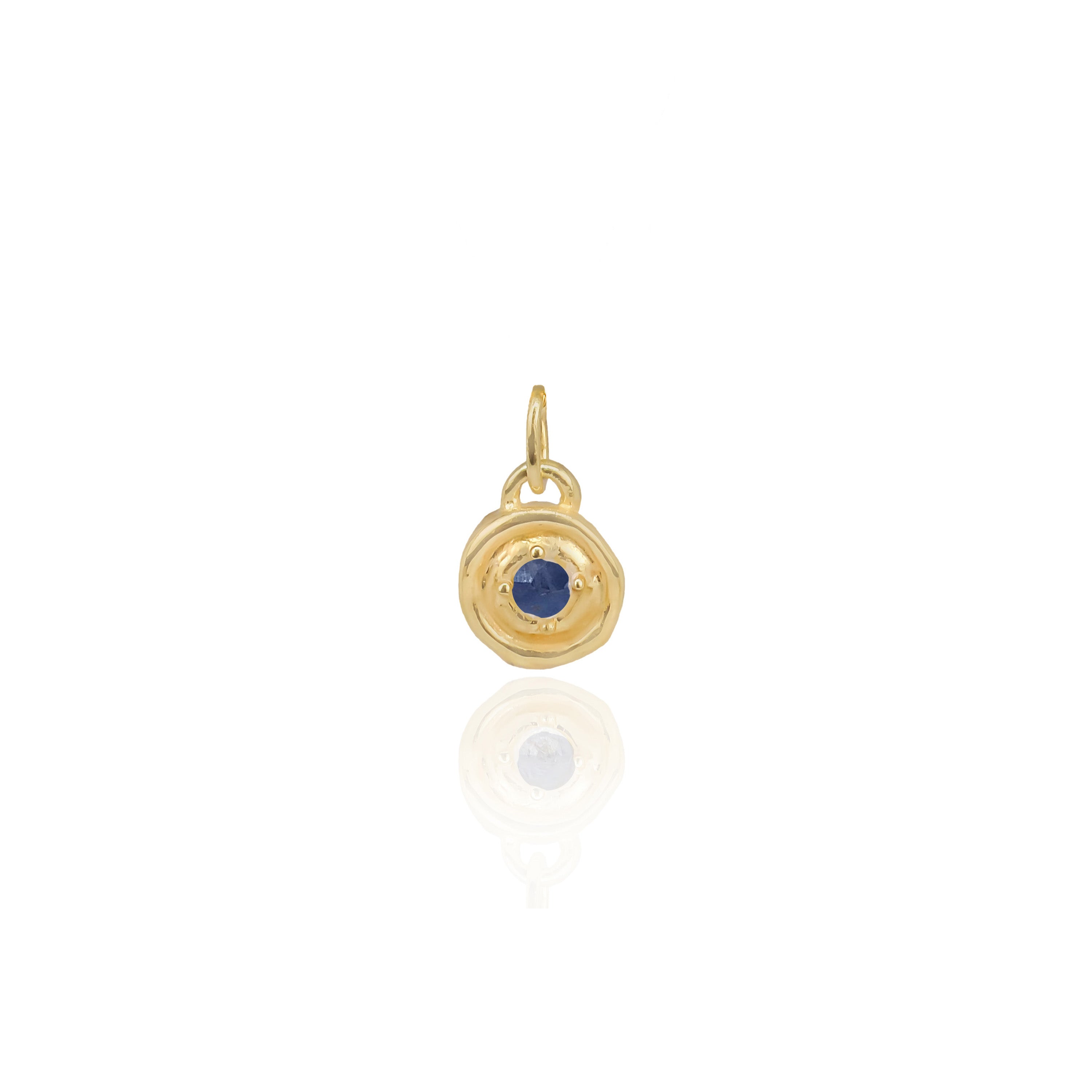 Gold pendant with a blue gemstone on a white background