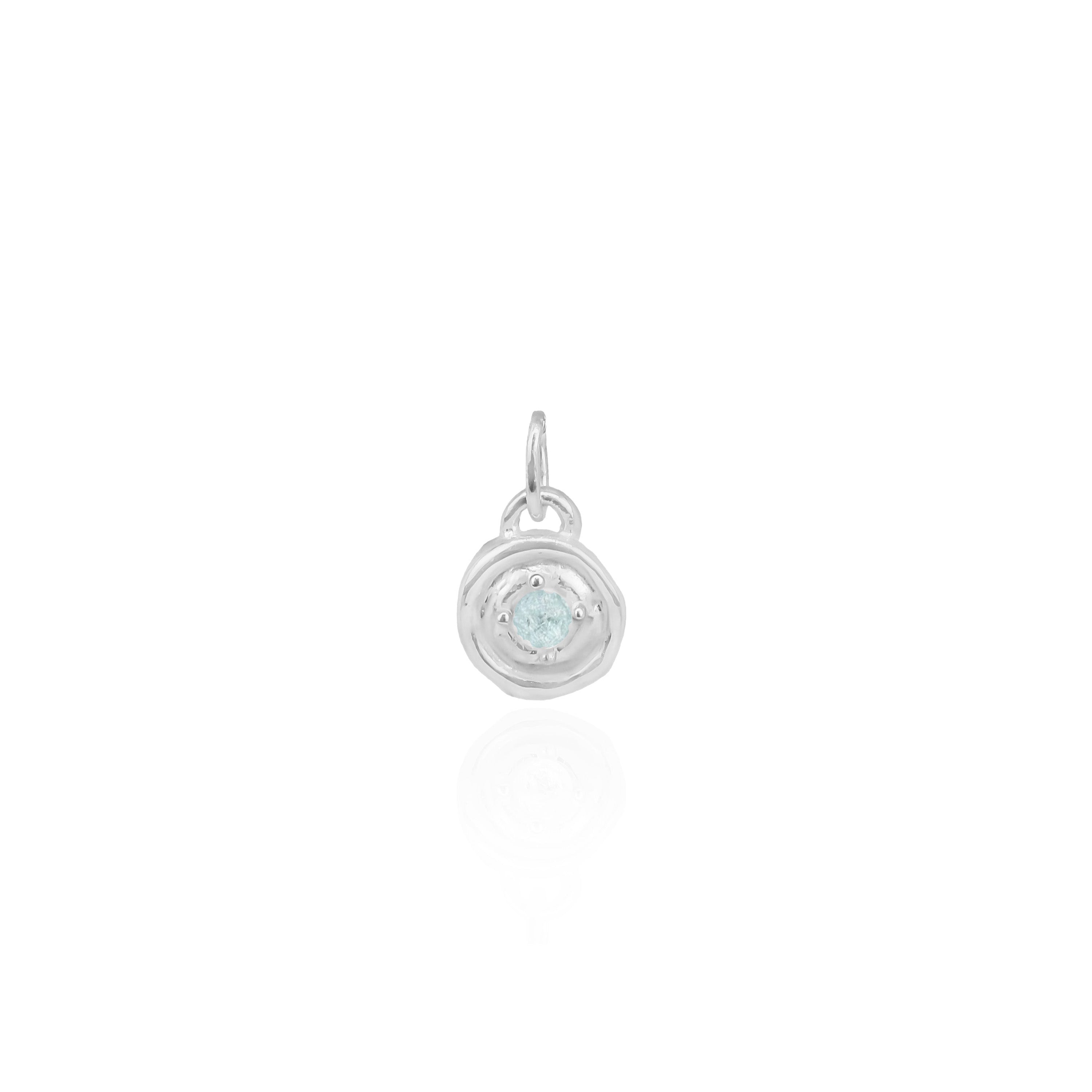 Silver pendant with a gemstone on a white background