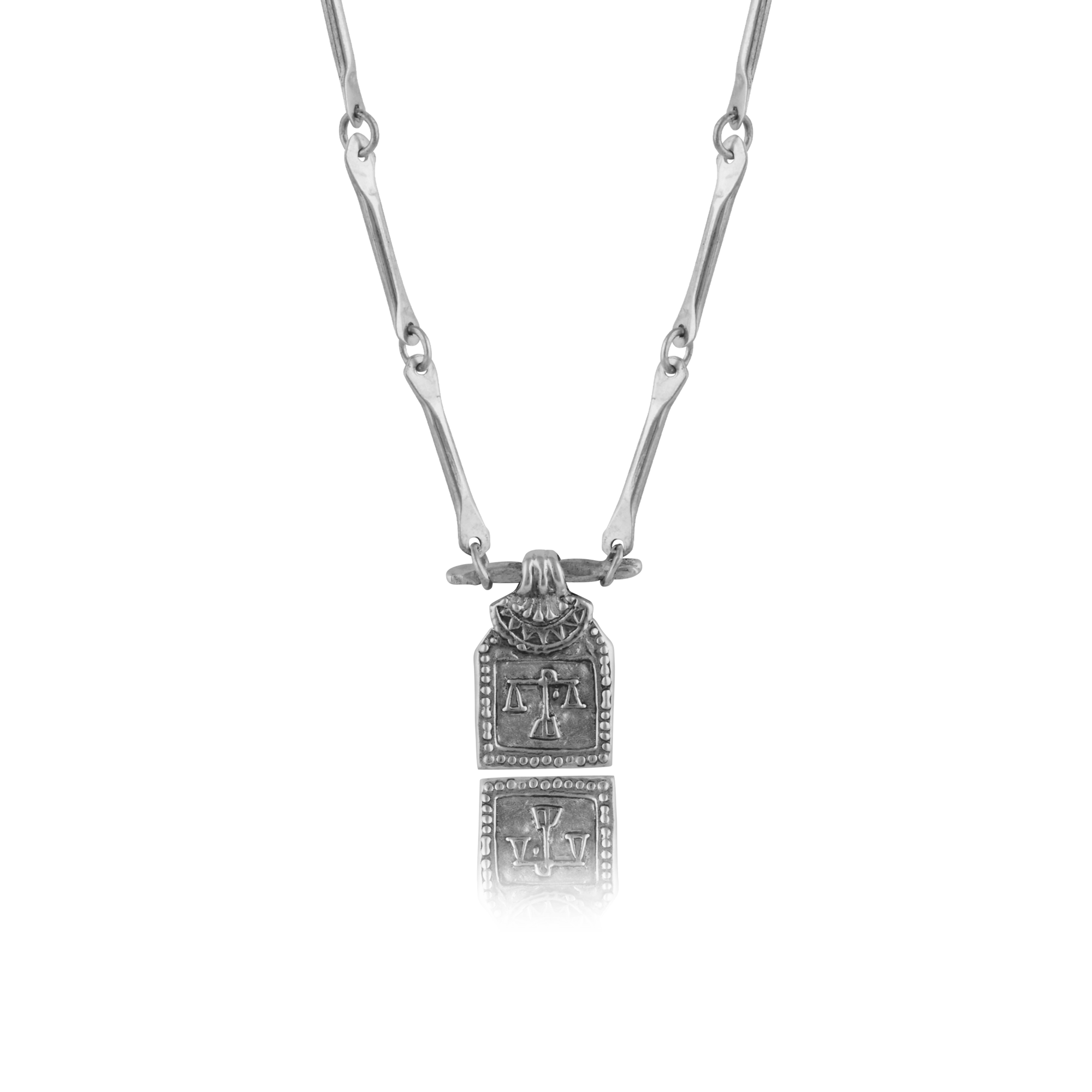 Silver necklace with pendant of libra zodiac sign